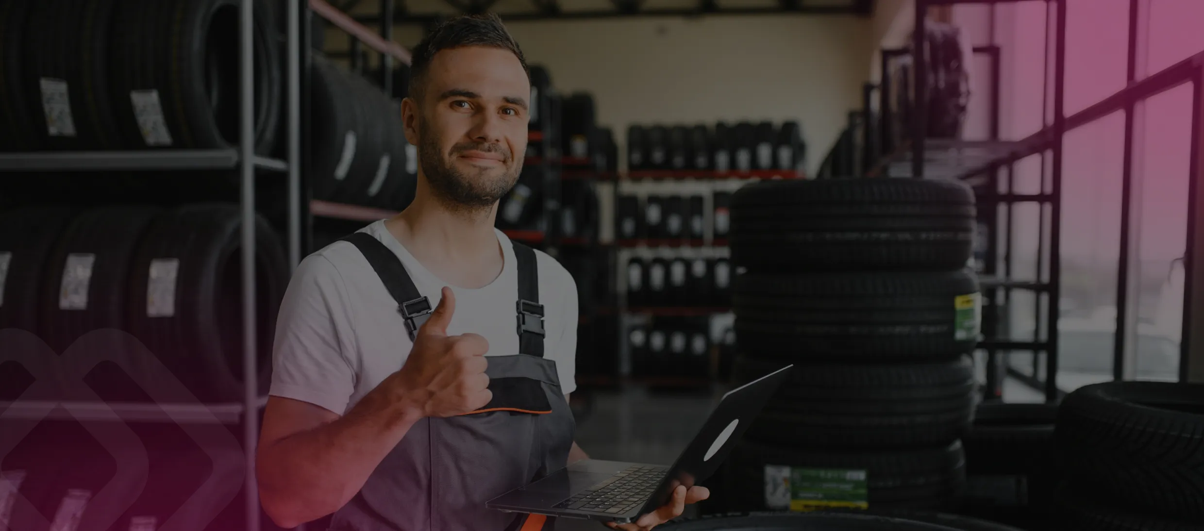 Mechanic giving a thumbs up with a tablet