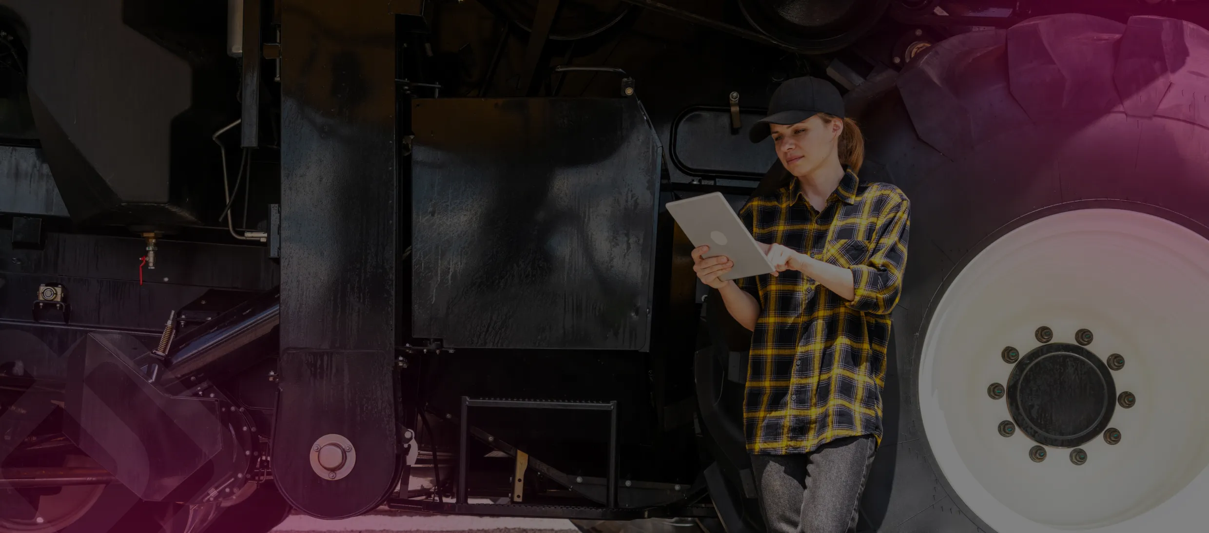 Worker checking machinery with a clipboard