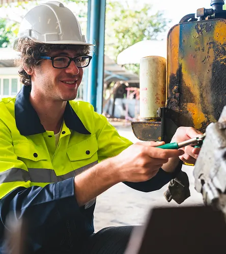 Worker in hi-vis using a handheld scanner