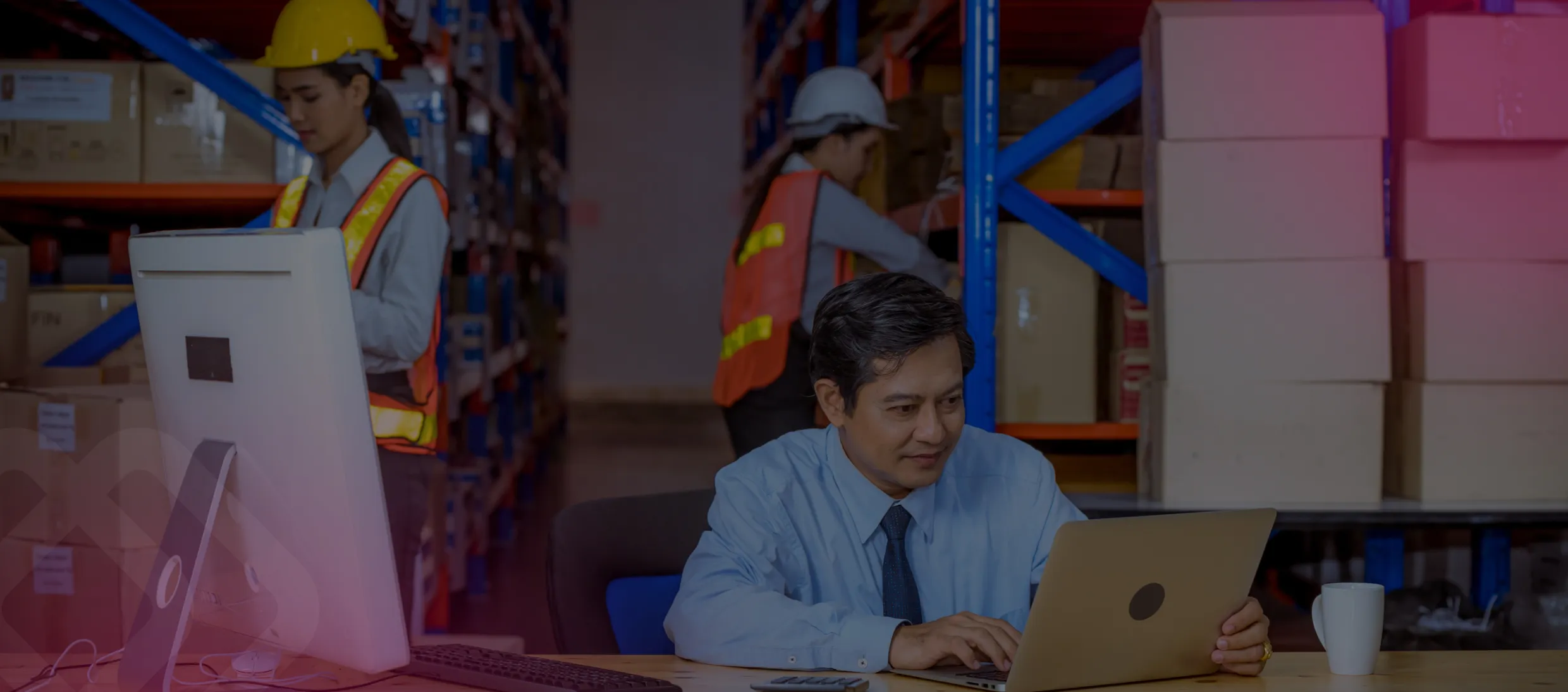 Warehouse workers using a laptop