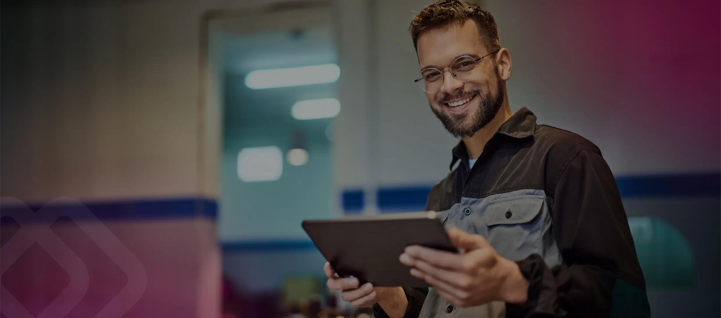 Smiling worker holding a tablet
