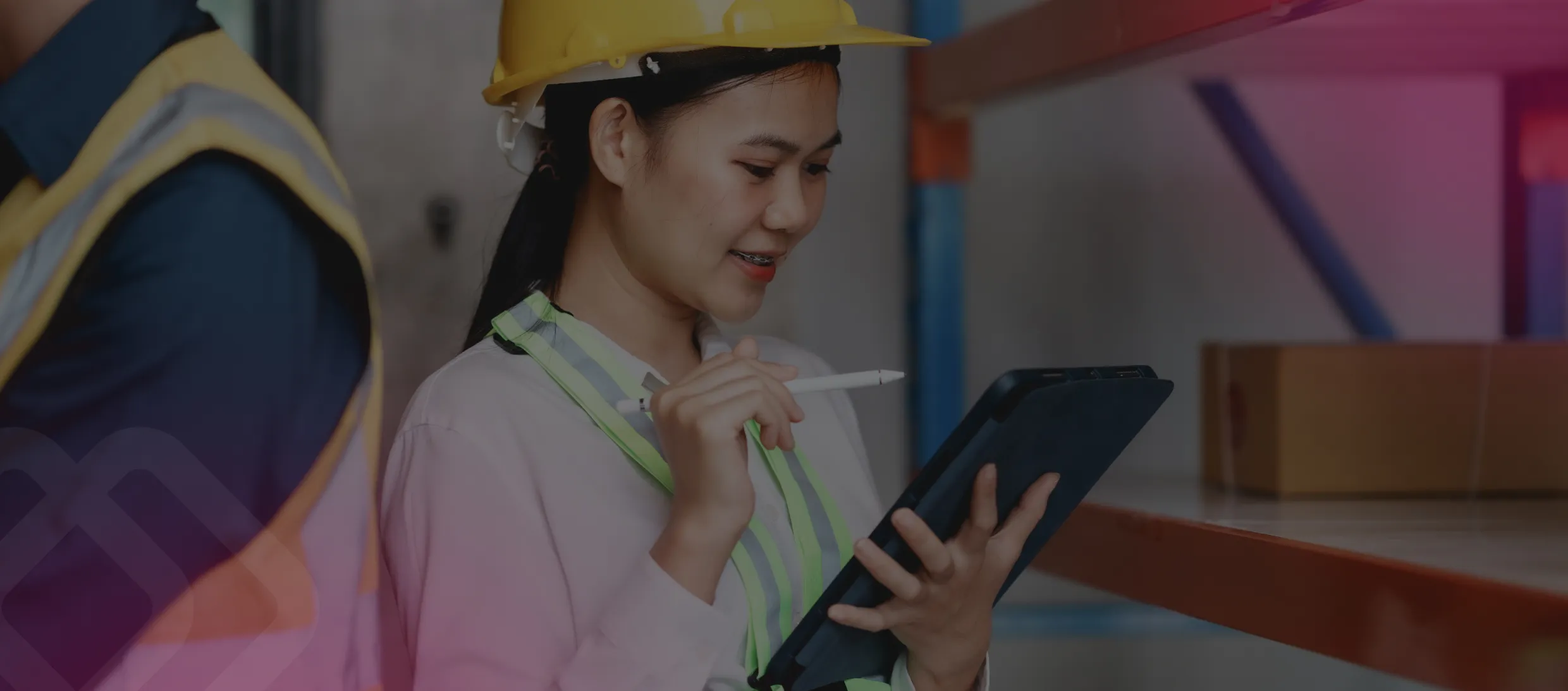 Worker using a tablet in a warehouse