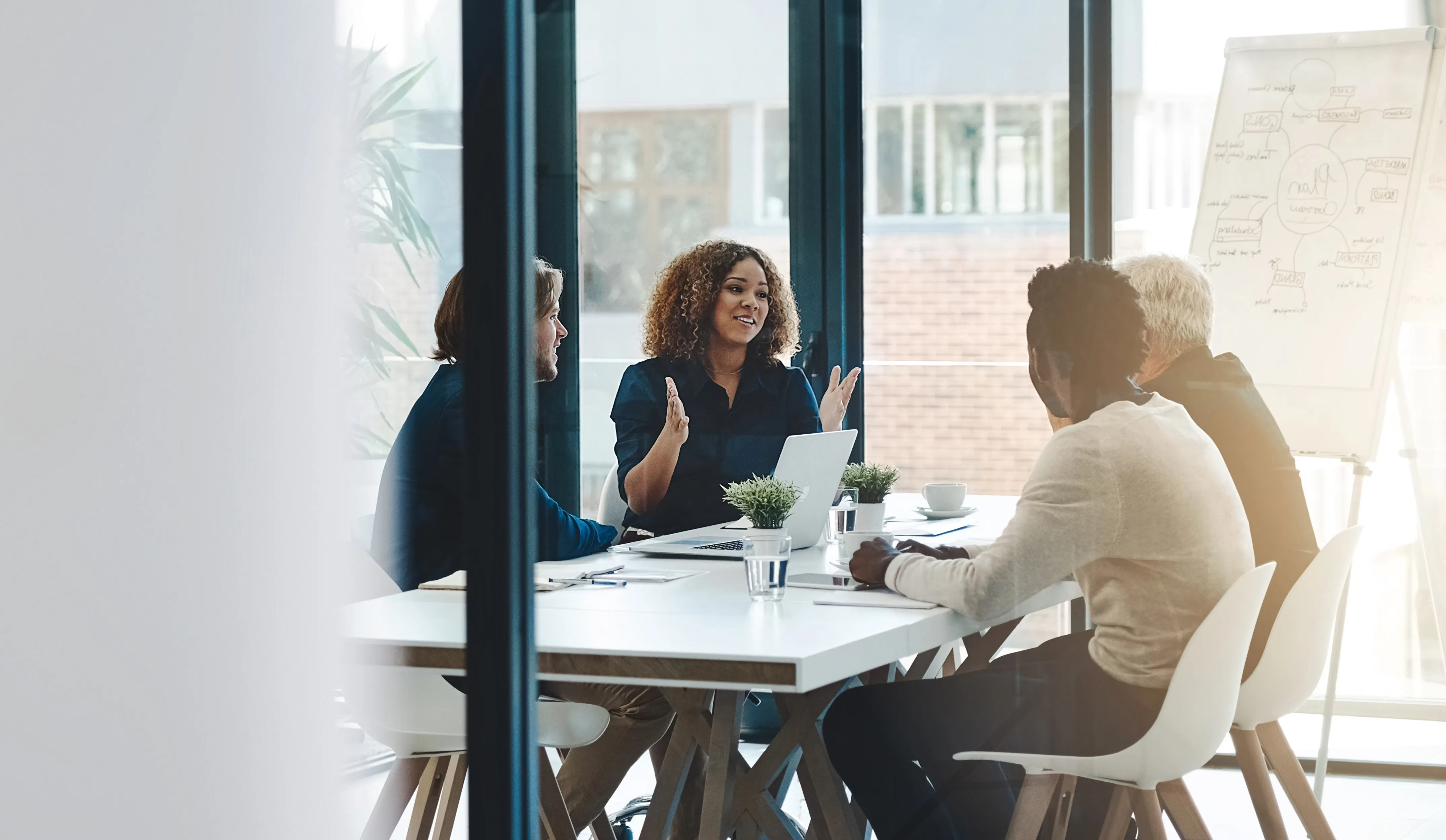 Team meeting in a glass-walled boardroom