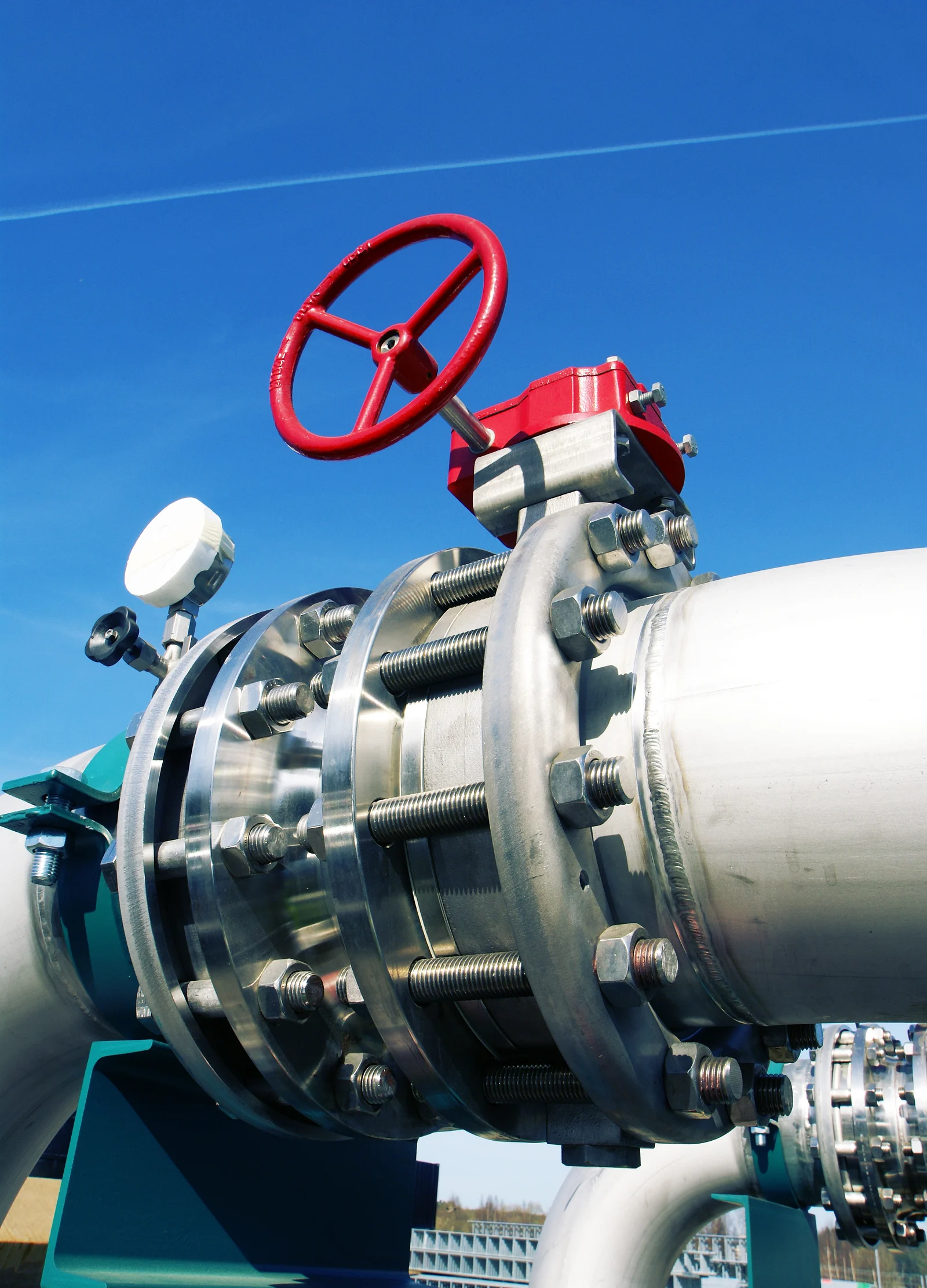 Large industrial pipe valve with a red handwheel