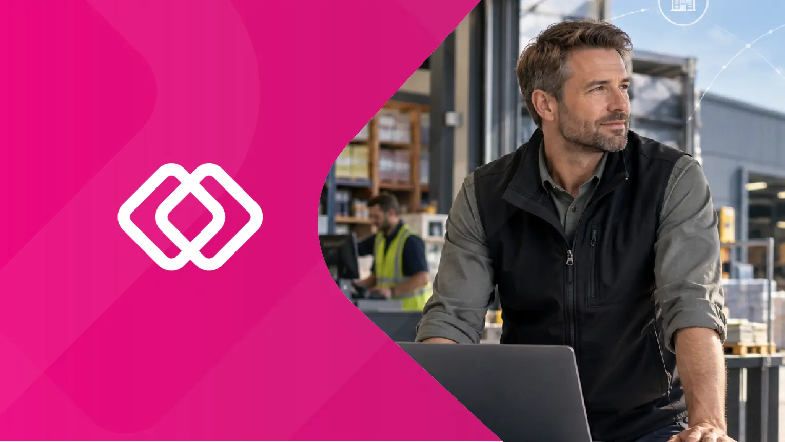 Builders merchant manager using laptop in a warehouse trade counter setting