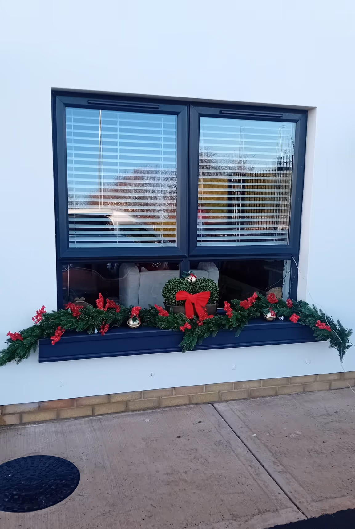 Black uPVC casement window fitted with matching sill on a white rendered house in Northern Ireland
