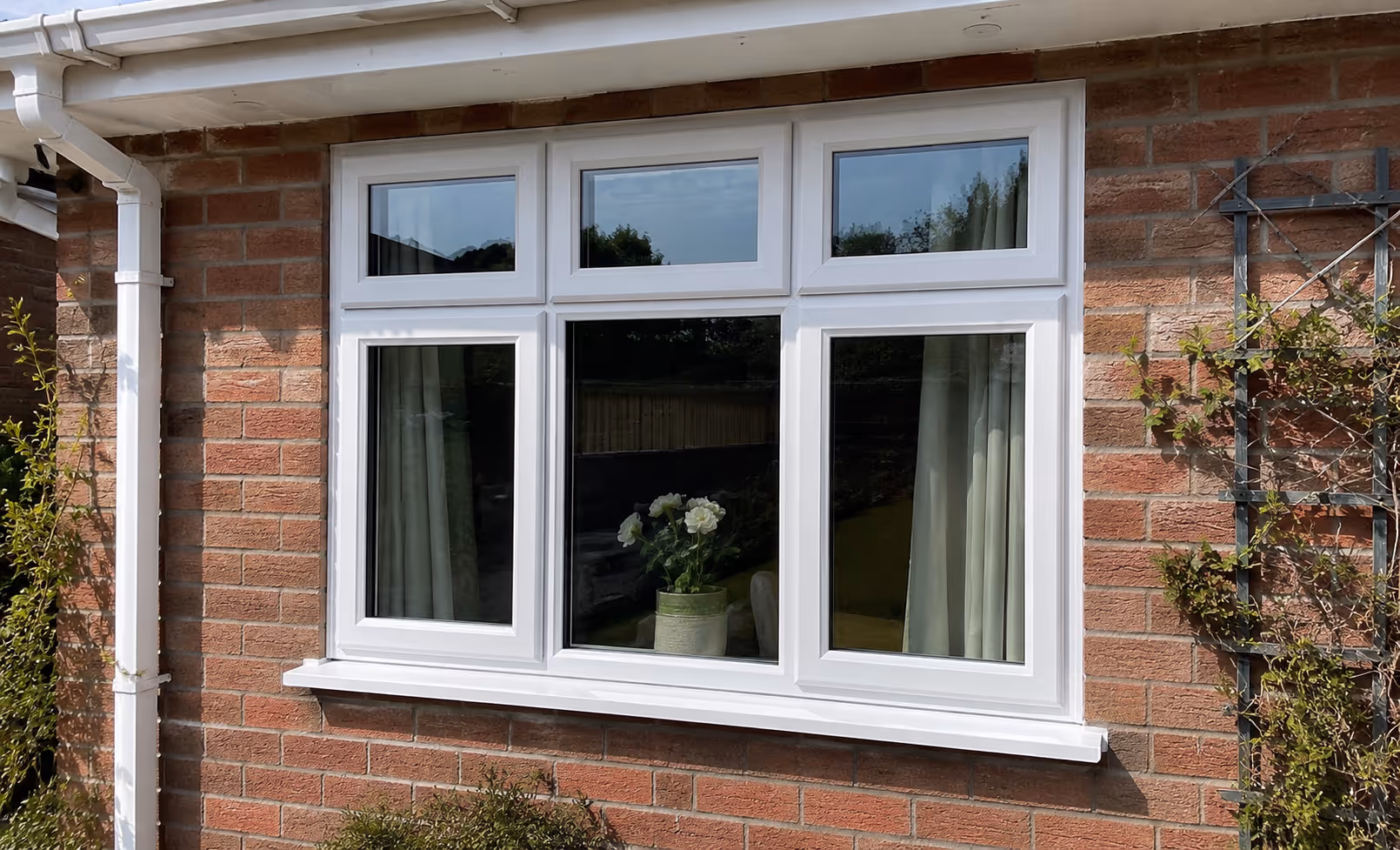 White uPVC casement windows fitted on a brick house in Northern Ireland