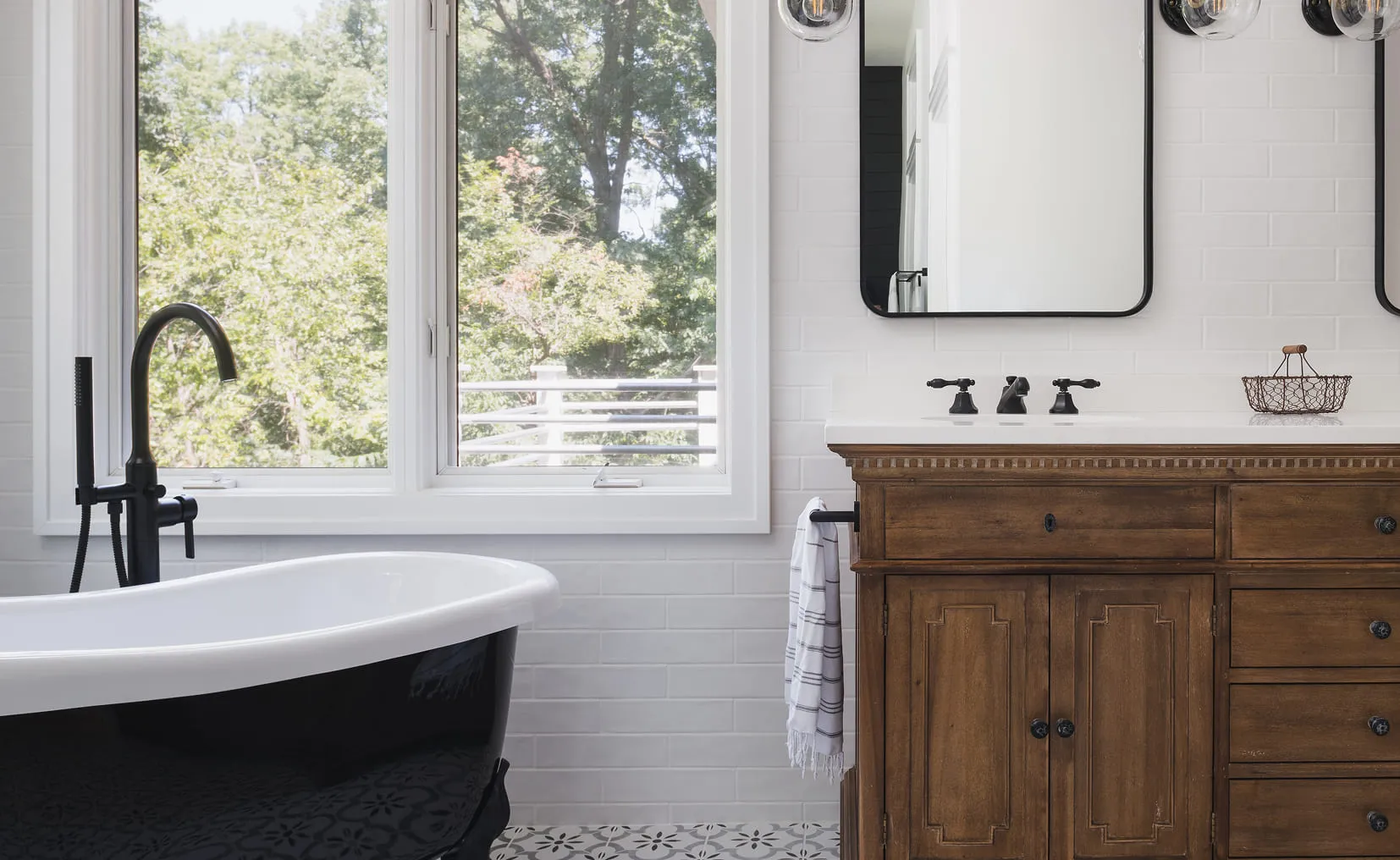 A bath room with a bath tub a sink and a window.