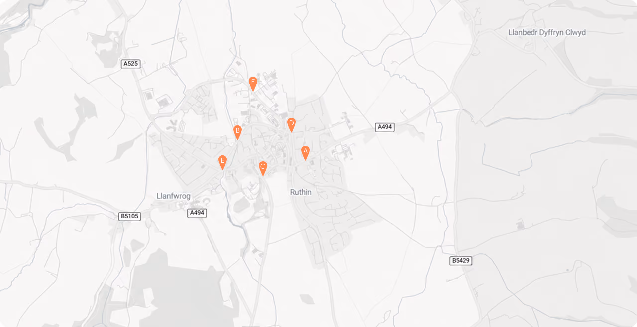 Map showing Ruthin town with six orange location markers labeled A to F and surrounding roads.