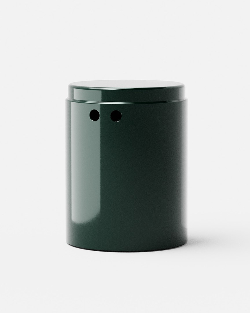 Odd Universe dark green ceramic vessel on a white backdrop — minimal product photography for the design label