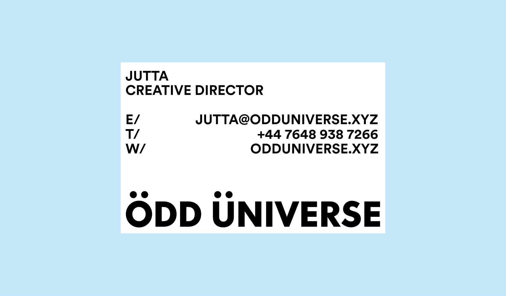 Odd Universe business card in black, white and orange on a soft blue background showing the ou monogram