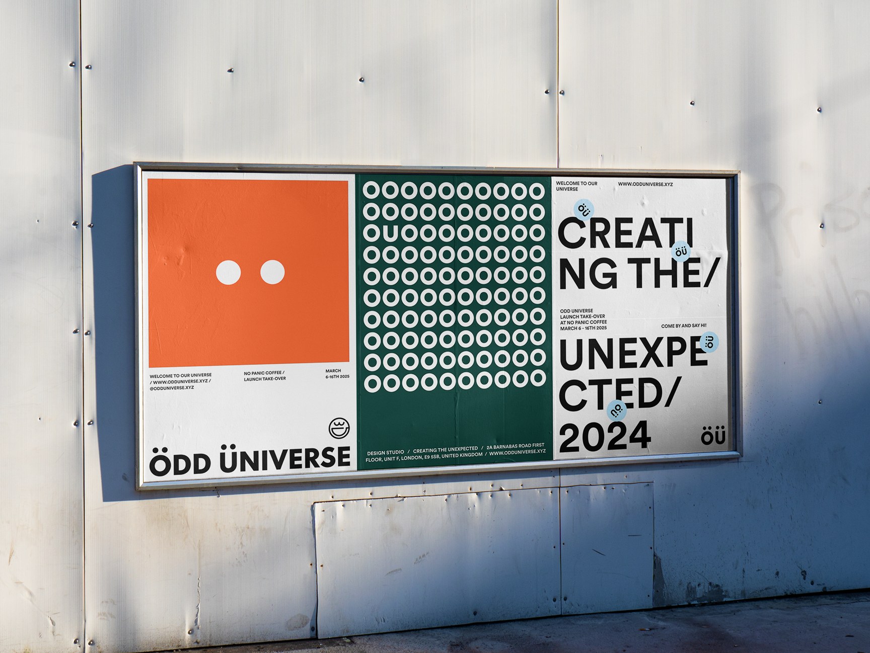 Odd Universe orange and grey posters pasted on a concrete wall, including Ellsewhere Coffee