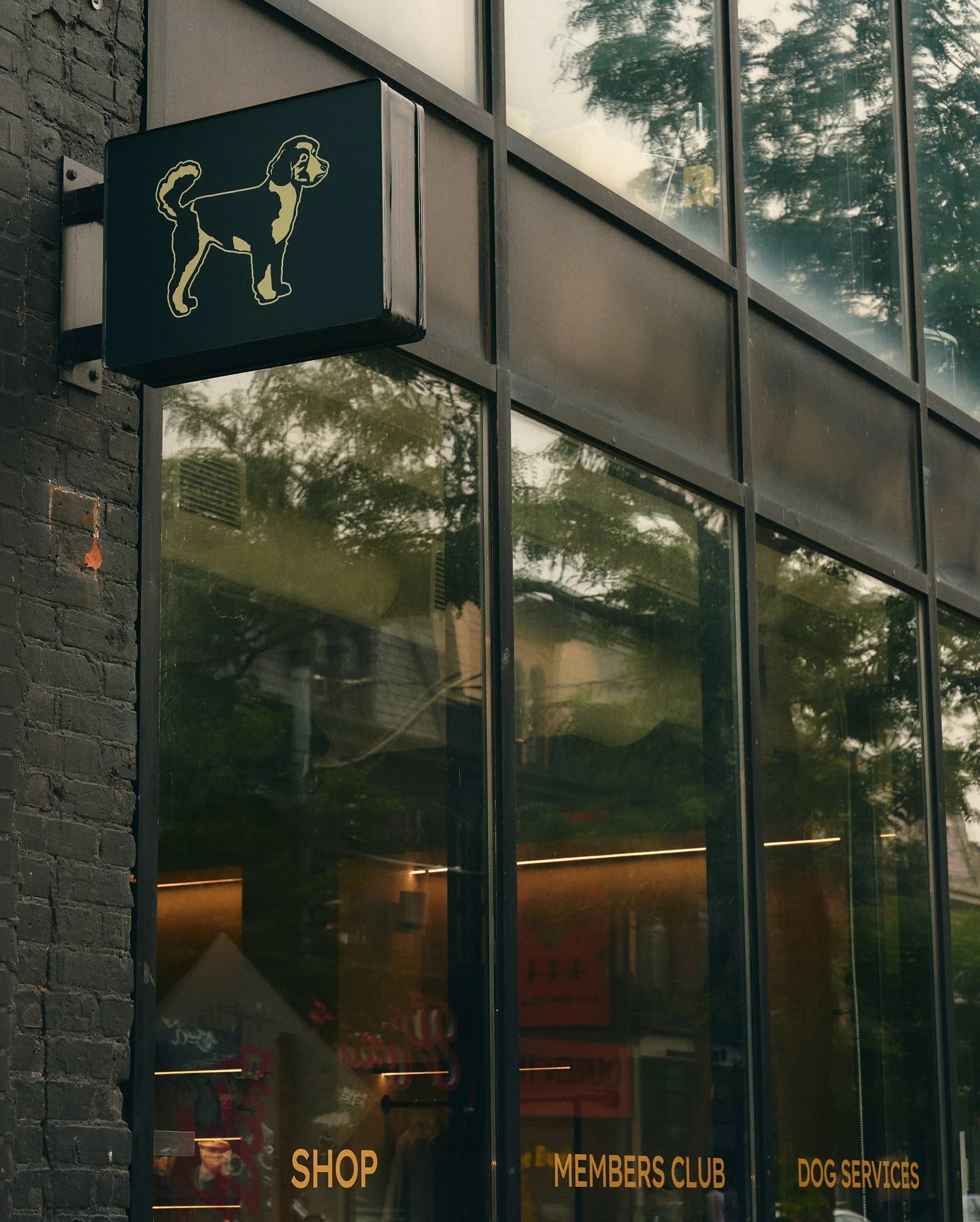 Hound House cafe exterior with green-framed windows and signage