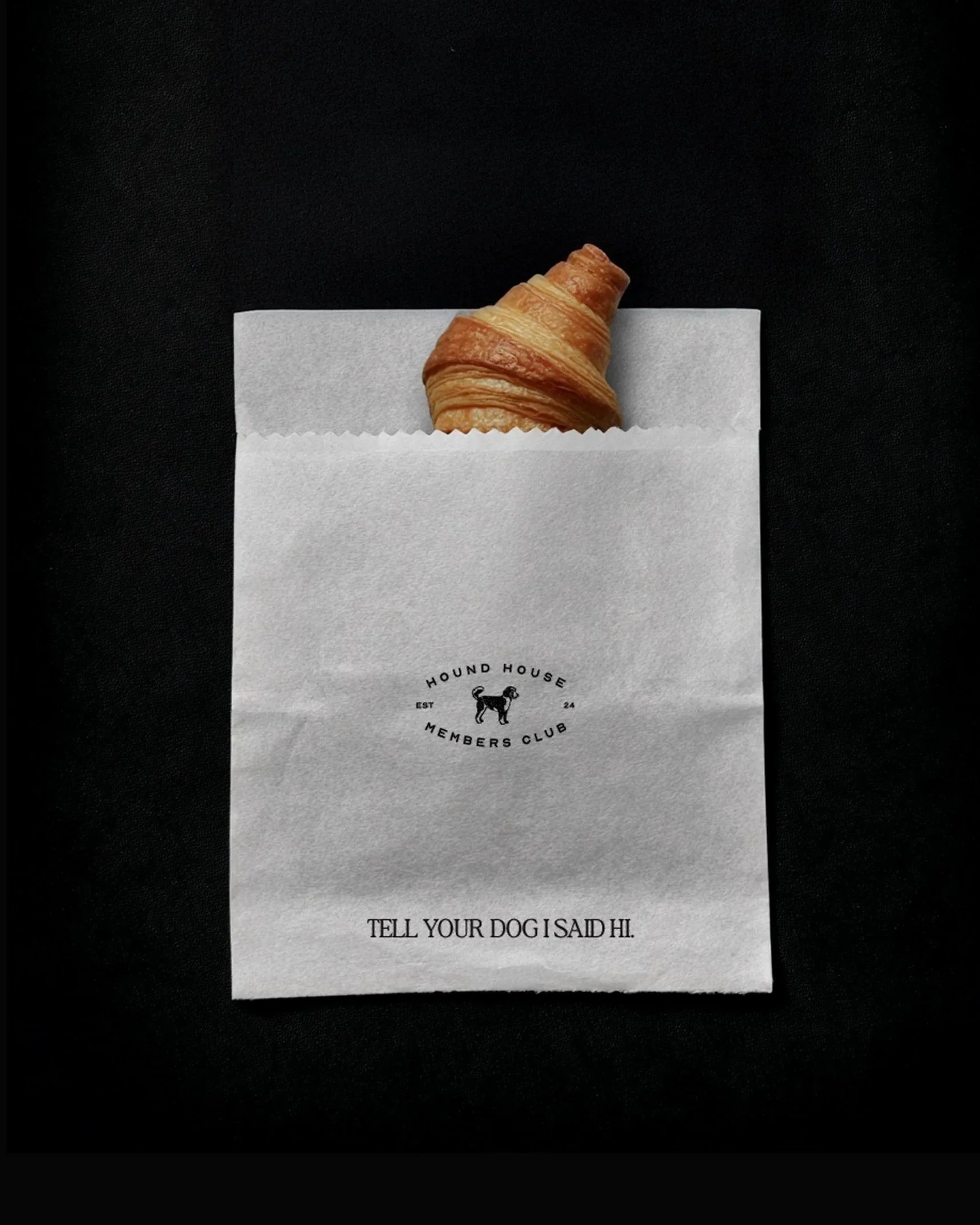 Hound House black paper bag mockup with brand illustration