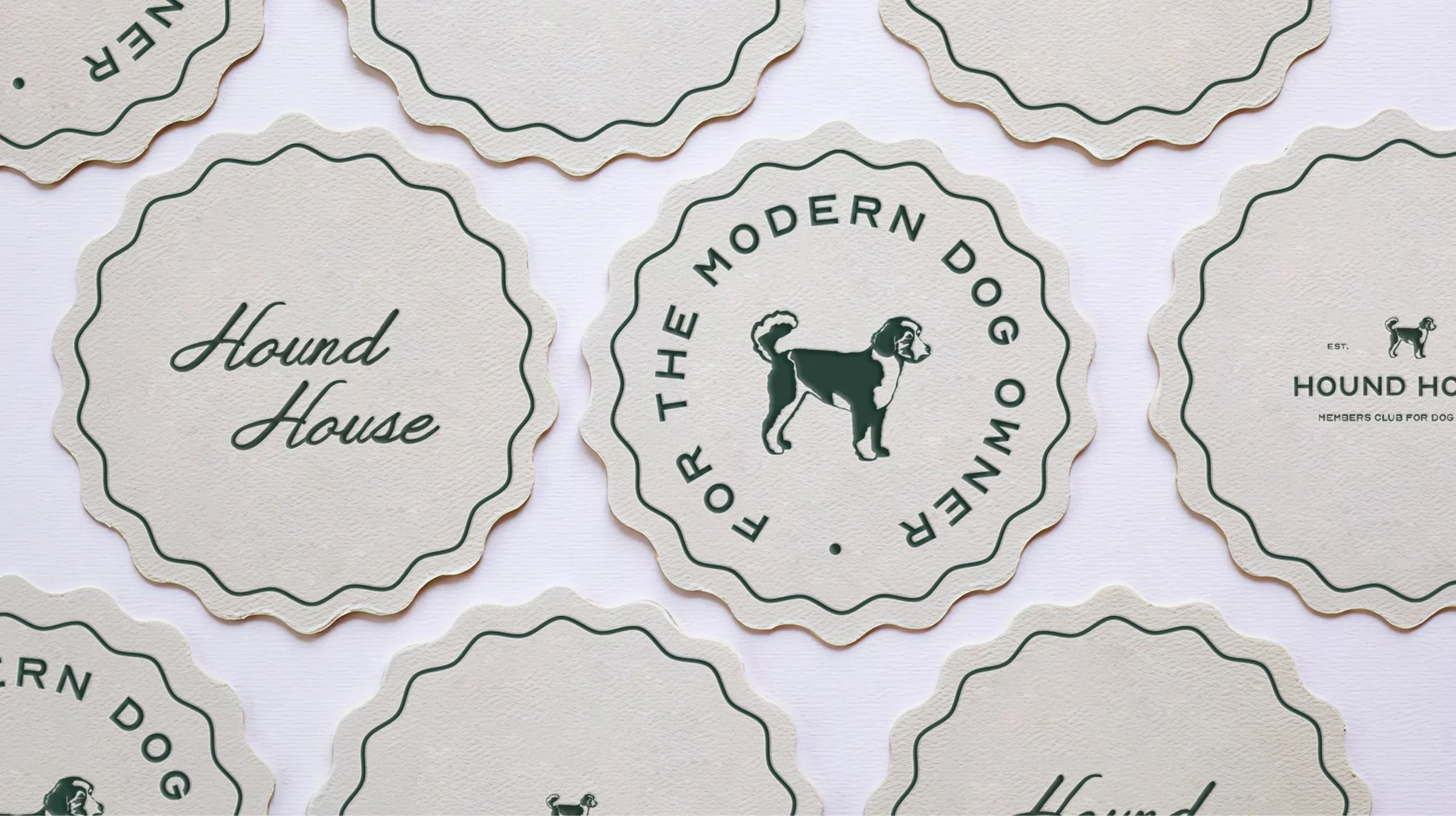 Hound House cream coasters printed with dog-icon graphics