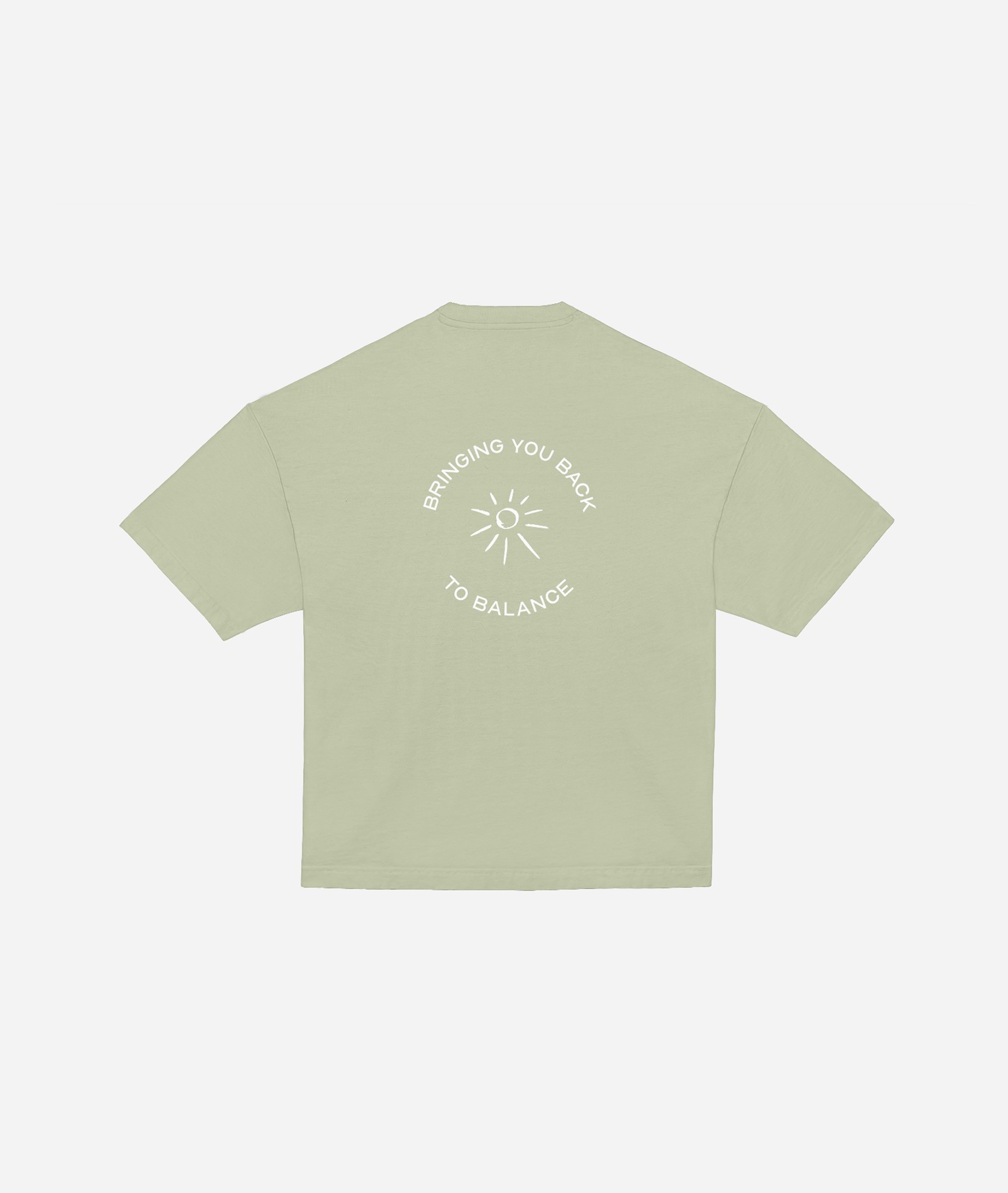 Kore Pilates sage-green t-shirt back print reading bringing you back to balance with a sun motif
