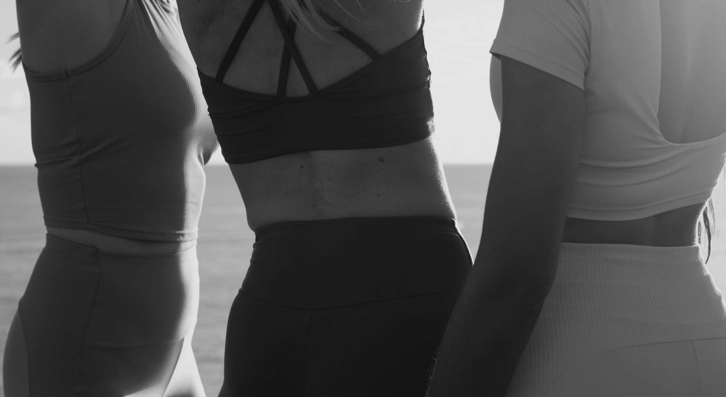 Kore Pilates black-and-white photography of a reformer workout in motion
