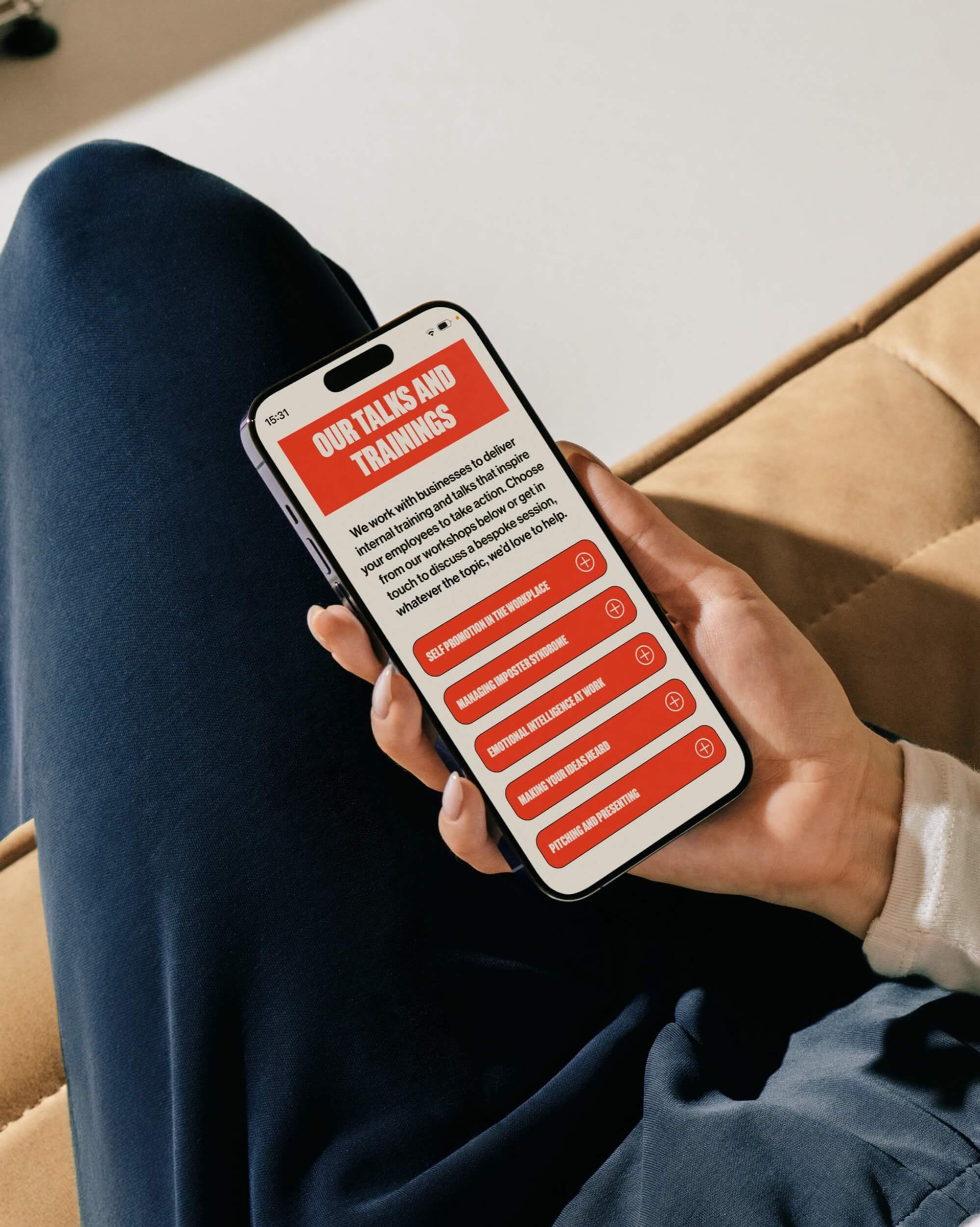 F*ck Being Humble website shown on a phone held in hand