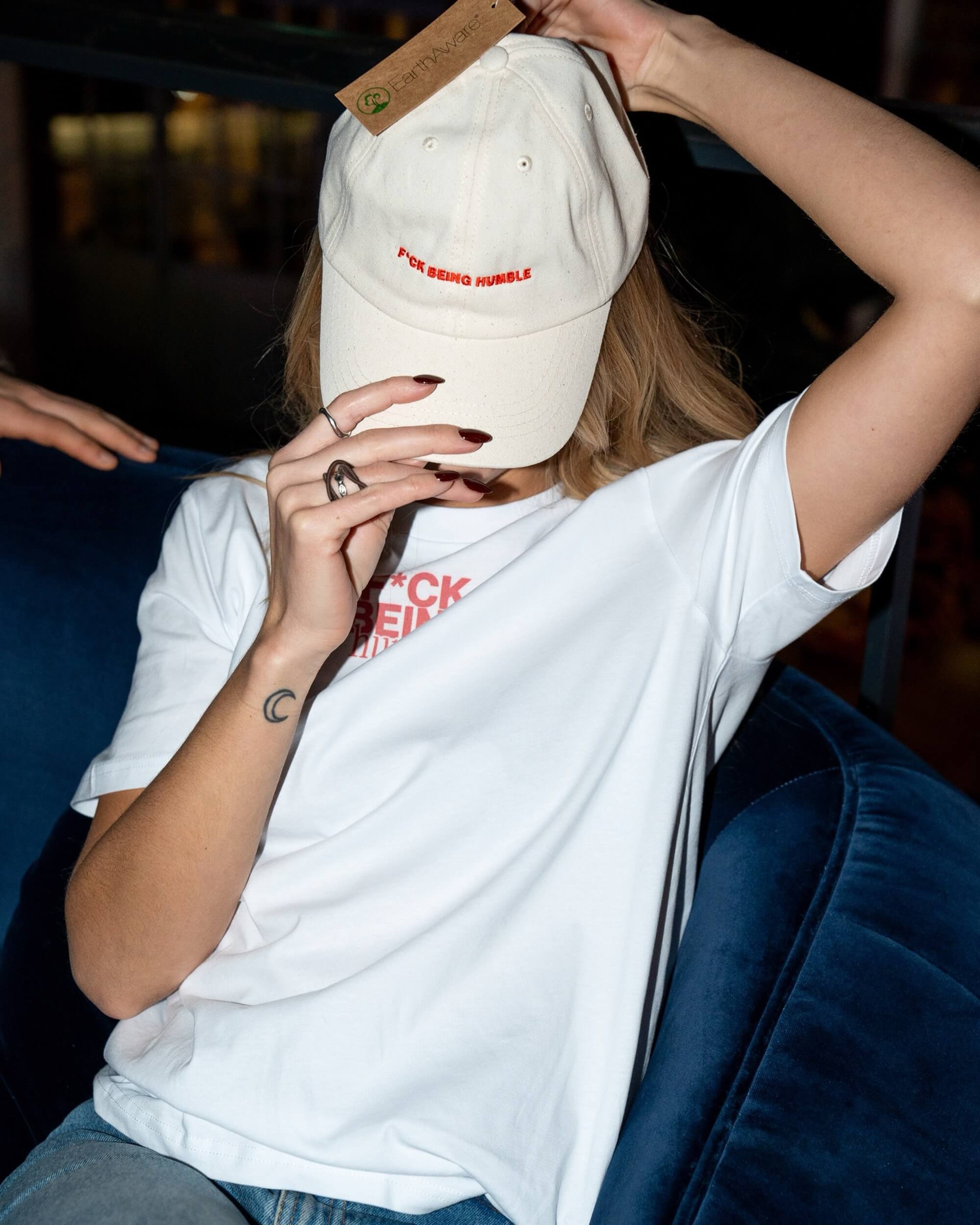 F*ck Being Humble cap and t-shirt worn by a person