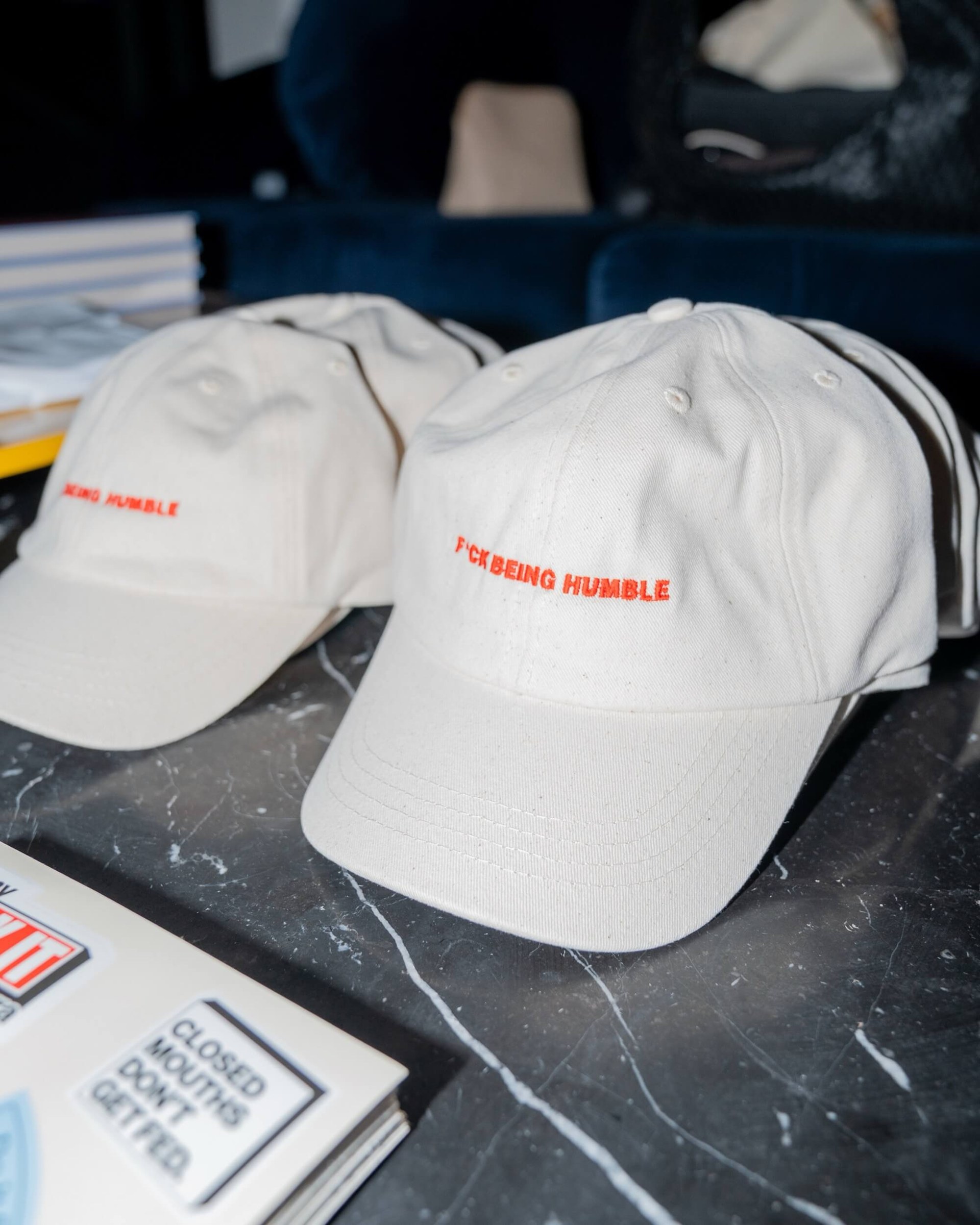 F*ck Being Humble white caps with red embroidery