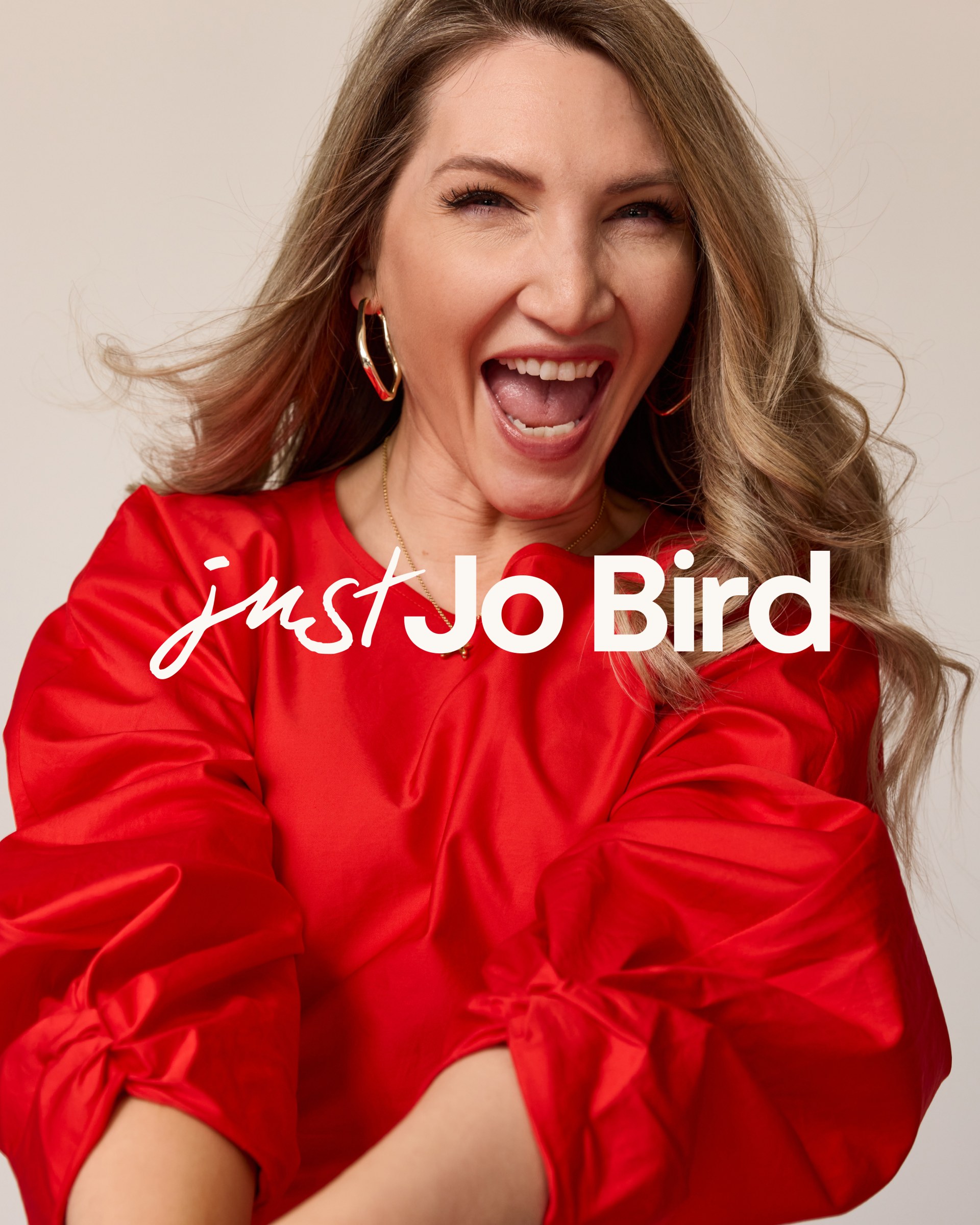Jo Bird brand portrait of the founder in red