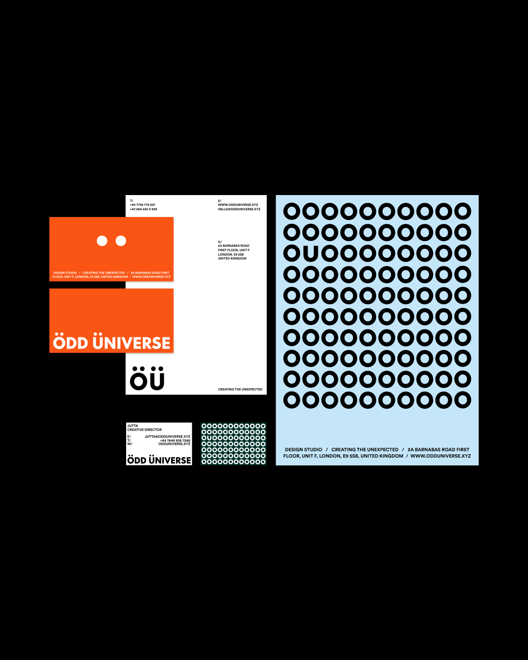 Odd Universe stationery and brand collateral layout on black