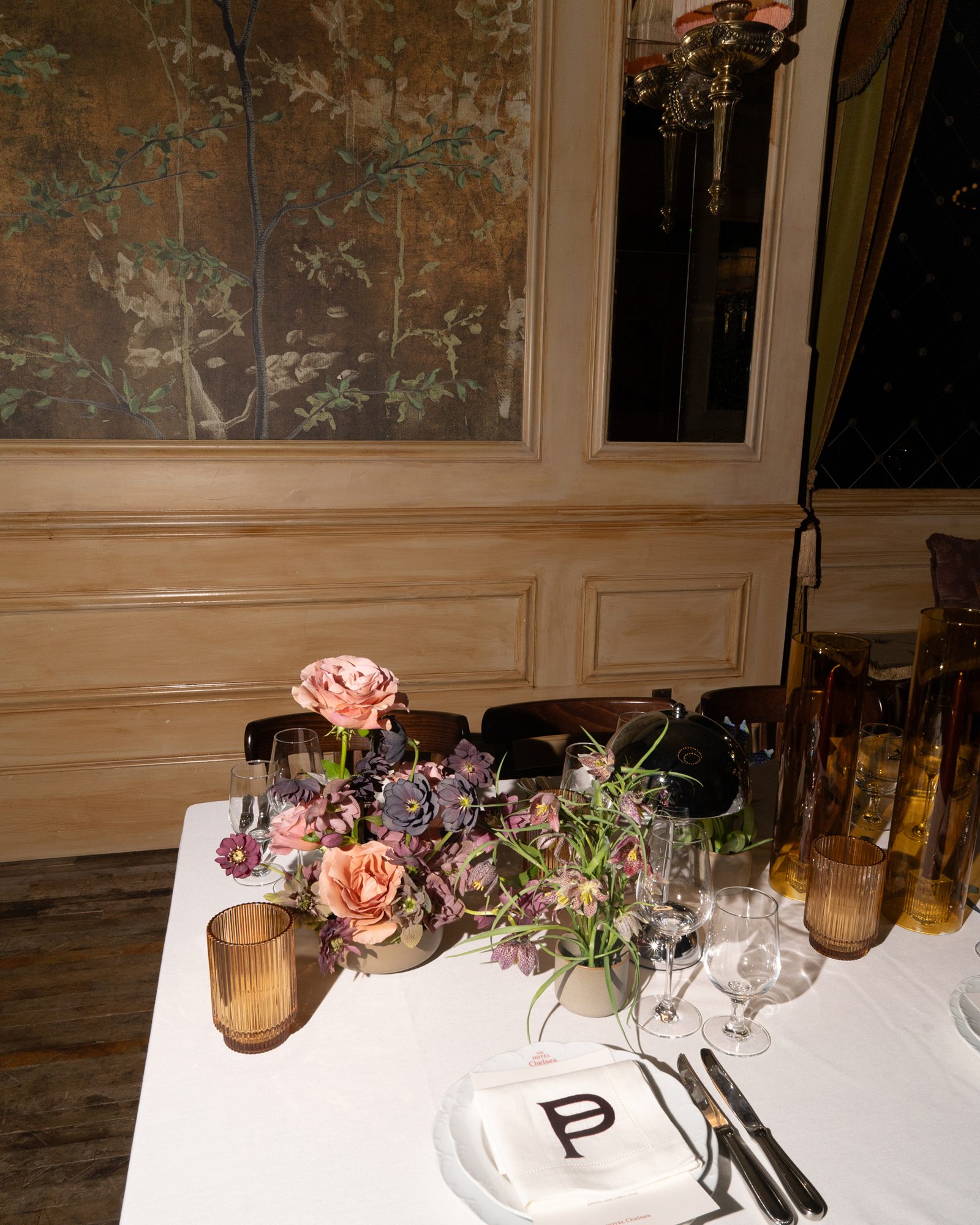 Patina styled interior table with flowers and a printed menu