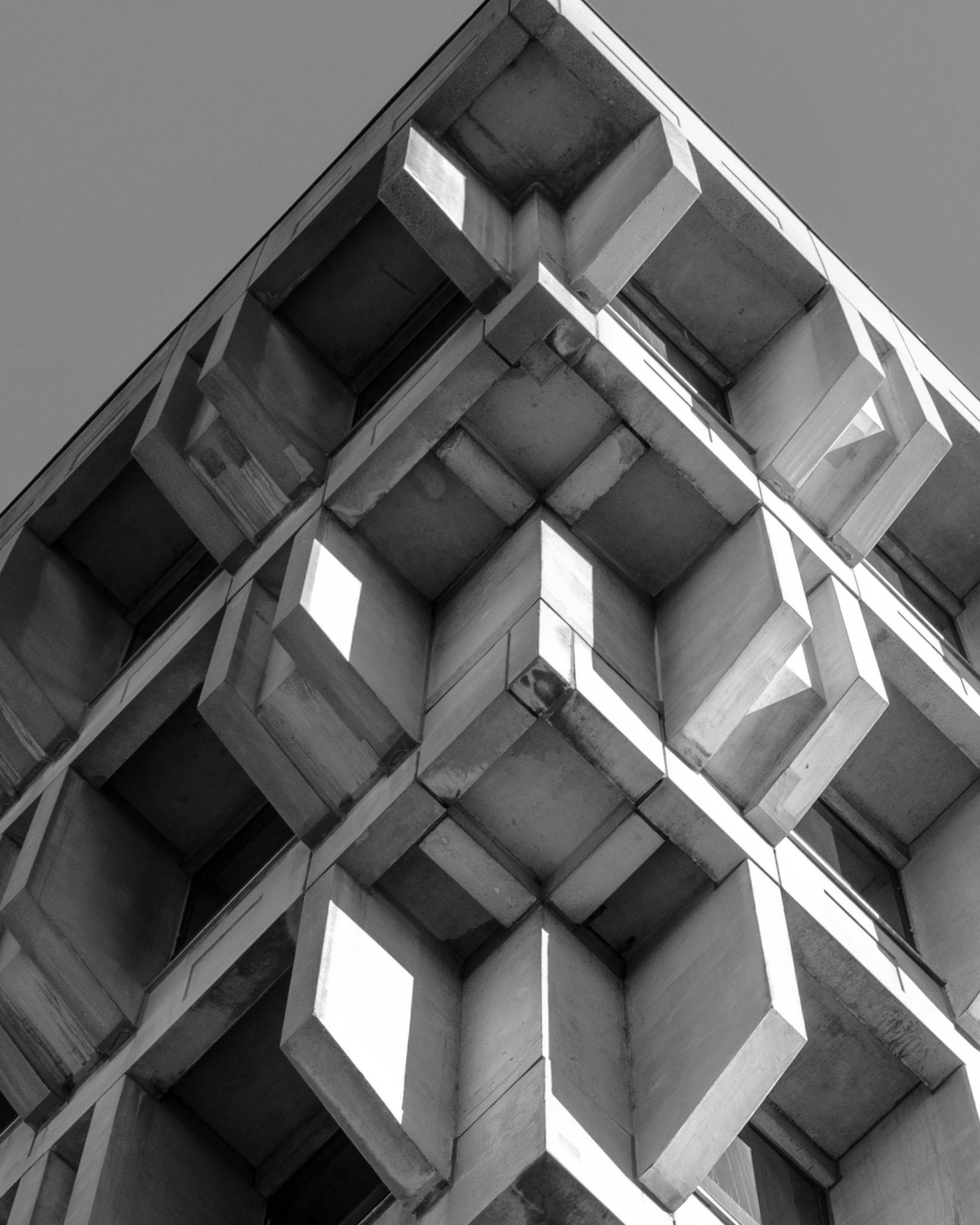 Black and white brutalist architecture from Real Impact Hub's art direction