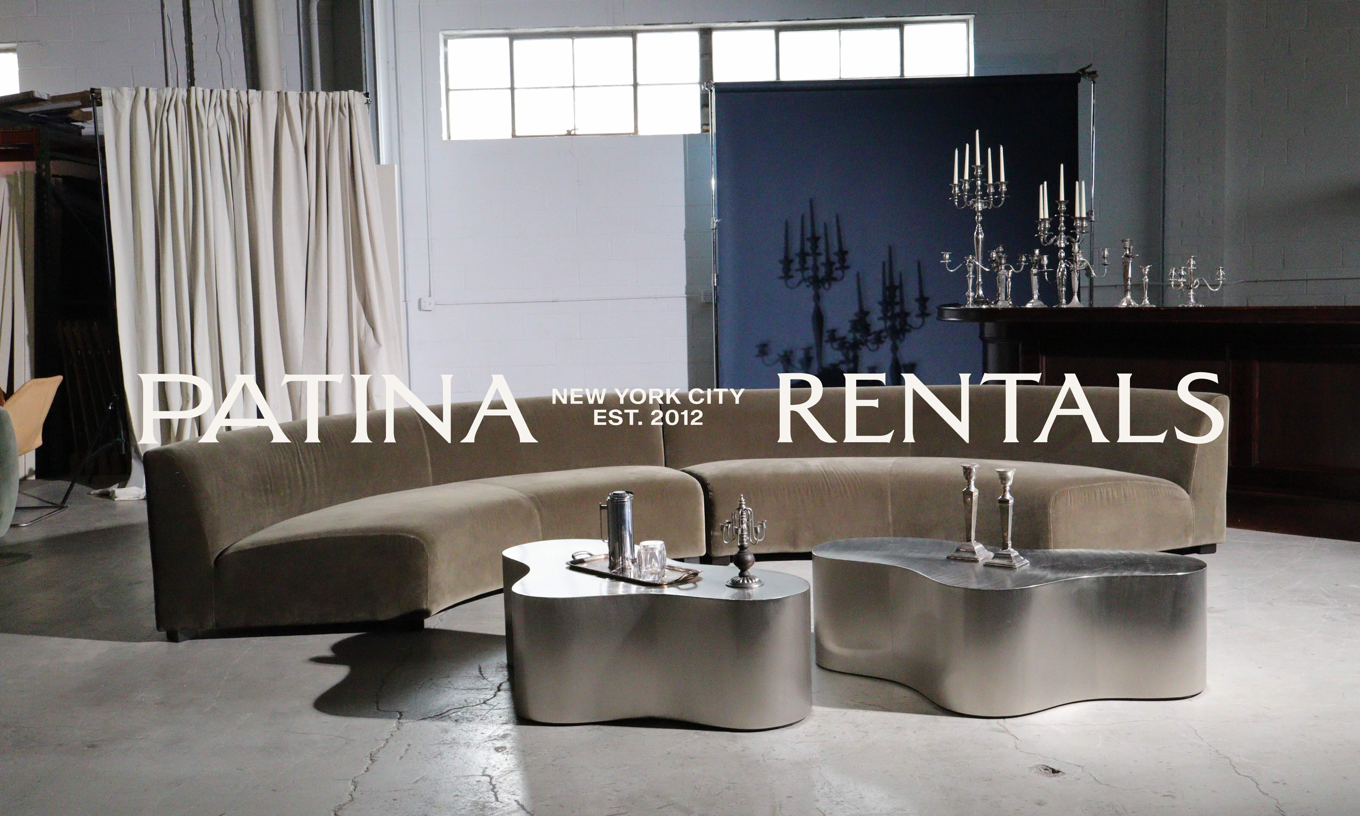 Patina Rentals wordmark over a styled event space with a curved sofa and sculptural silver tables