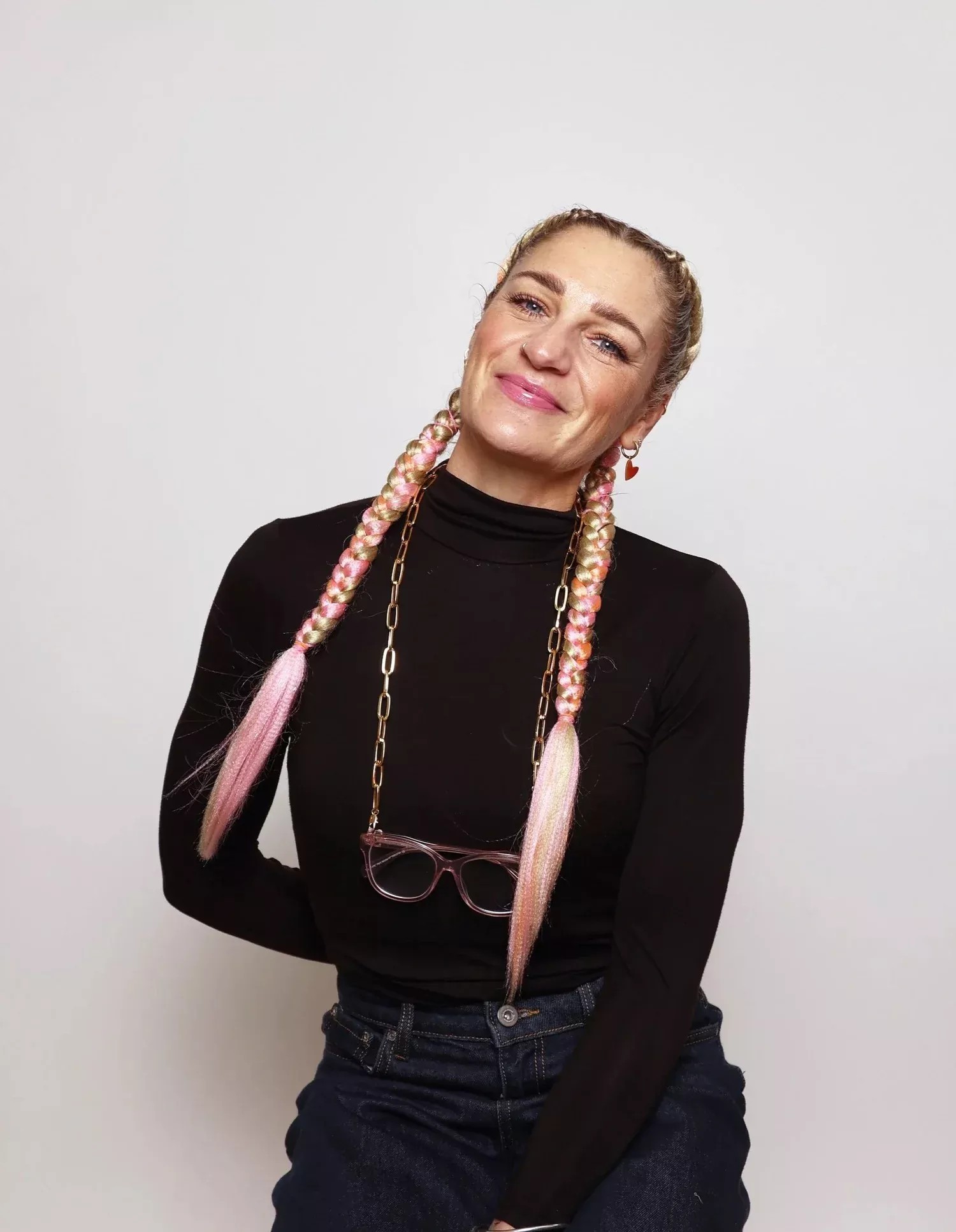 Lara Sheldrake, founder of Found & Flourish, in a black top with braided hair