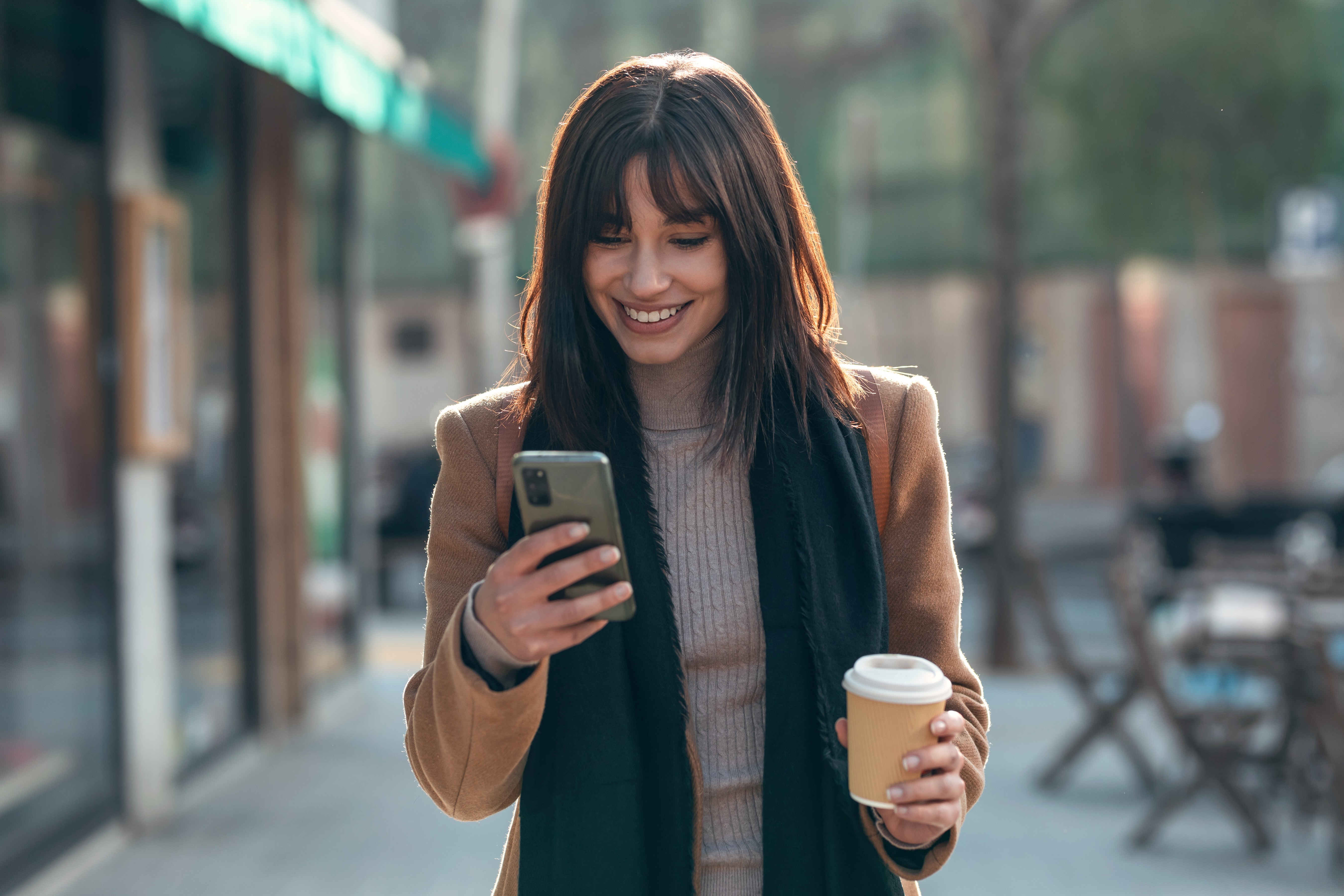 Woman using her phone stock photo