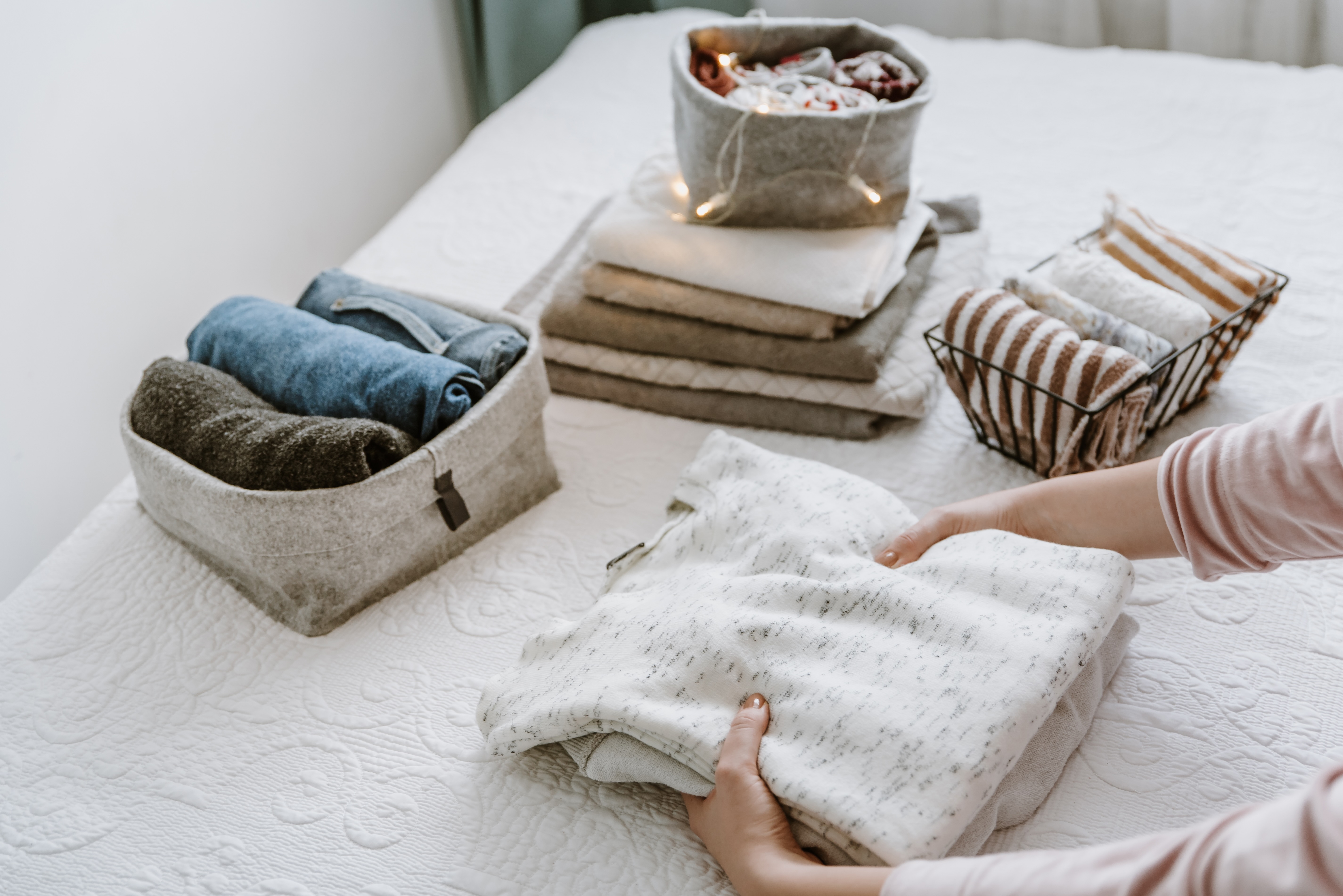 Woman folding laundry stock photo