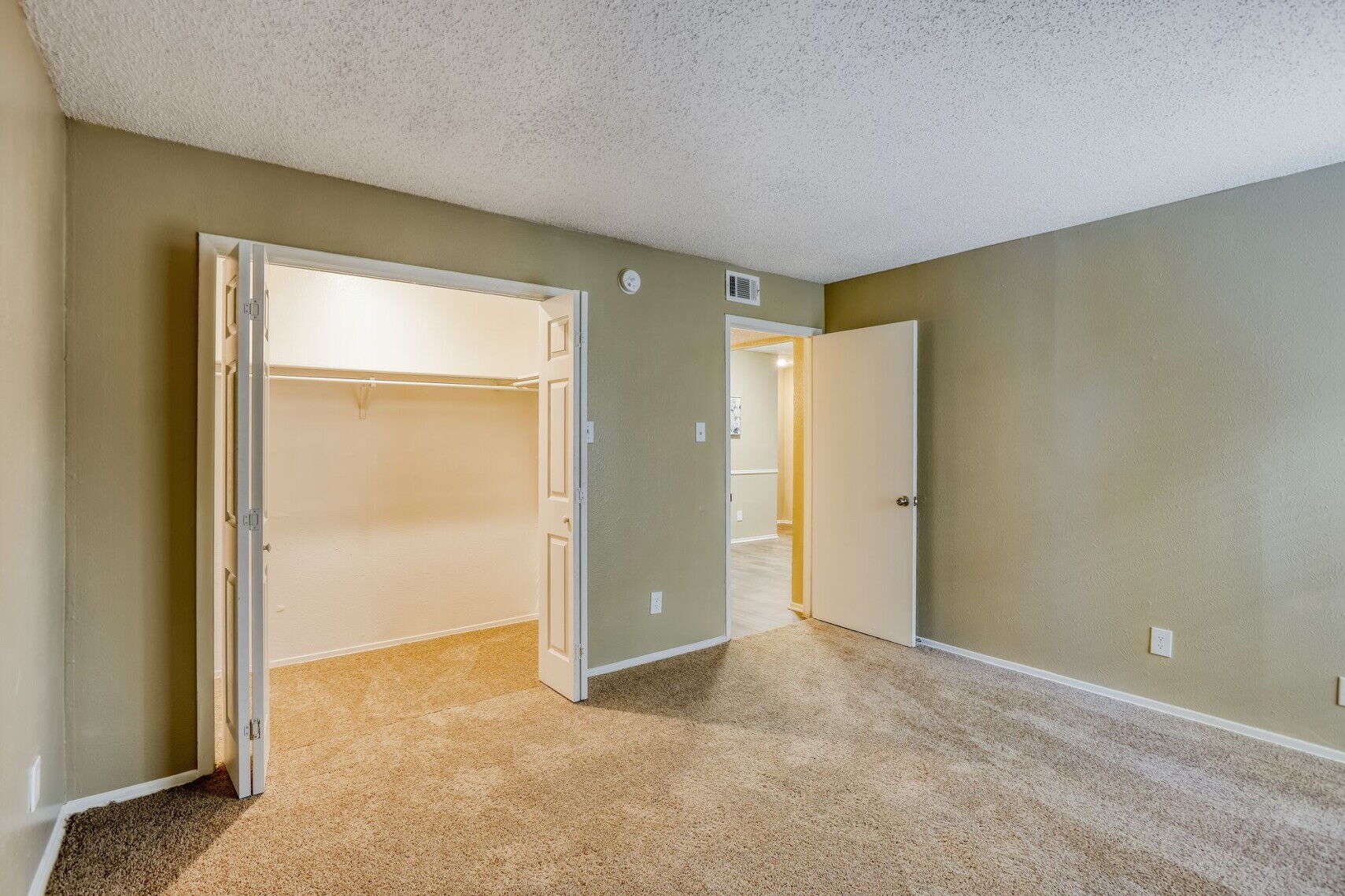 Bedroom at Spring Creek Apartments in Richardson, Texas