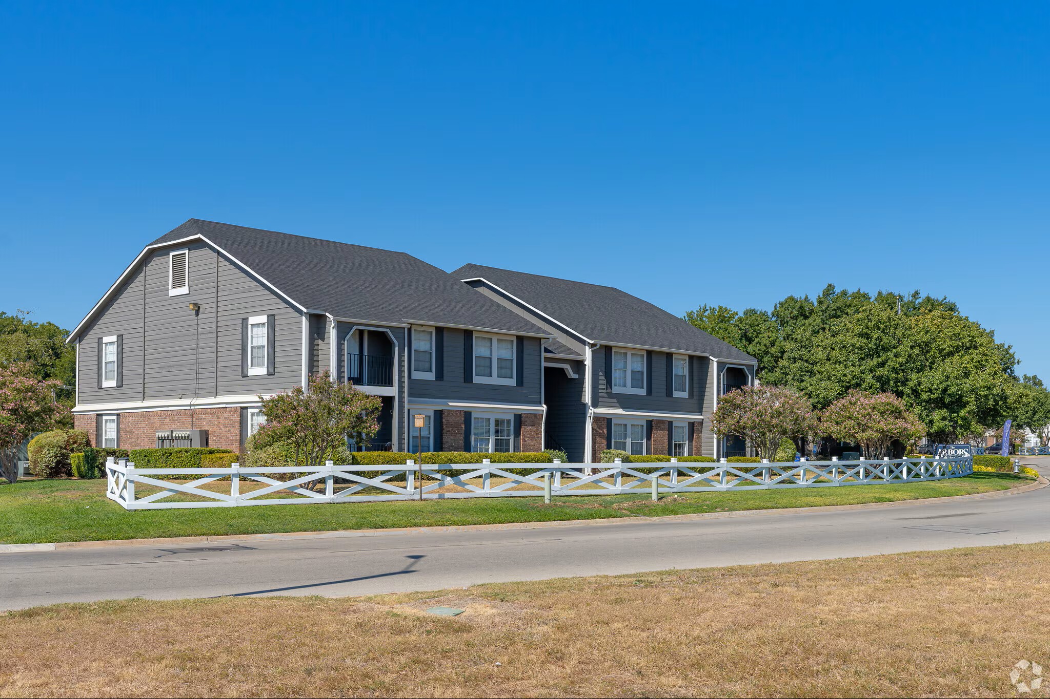 Apartment Building Exteriors at The Arbors of Burleson Apartments