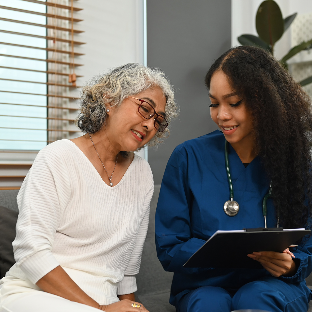 Doctor examining a patient's arm during a consultation