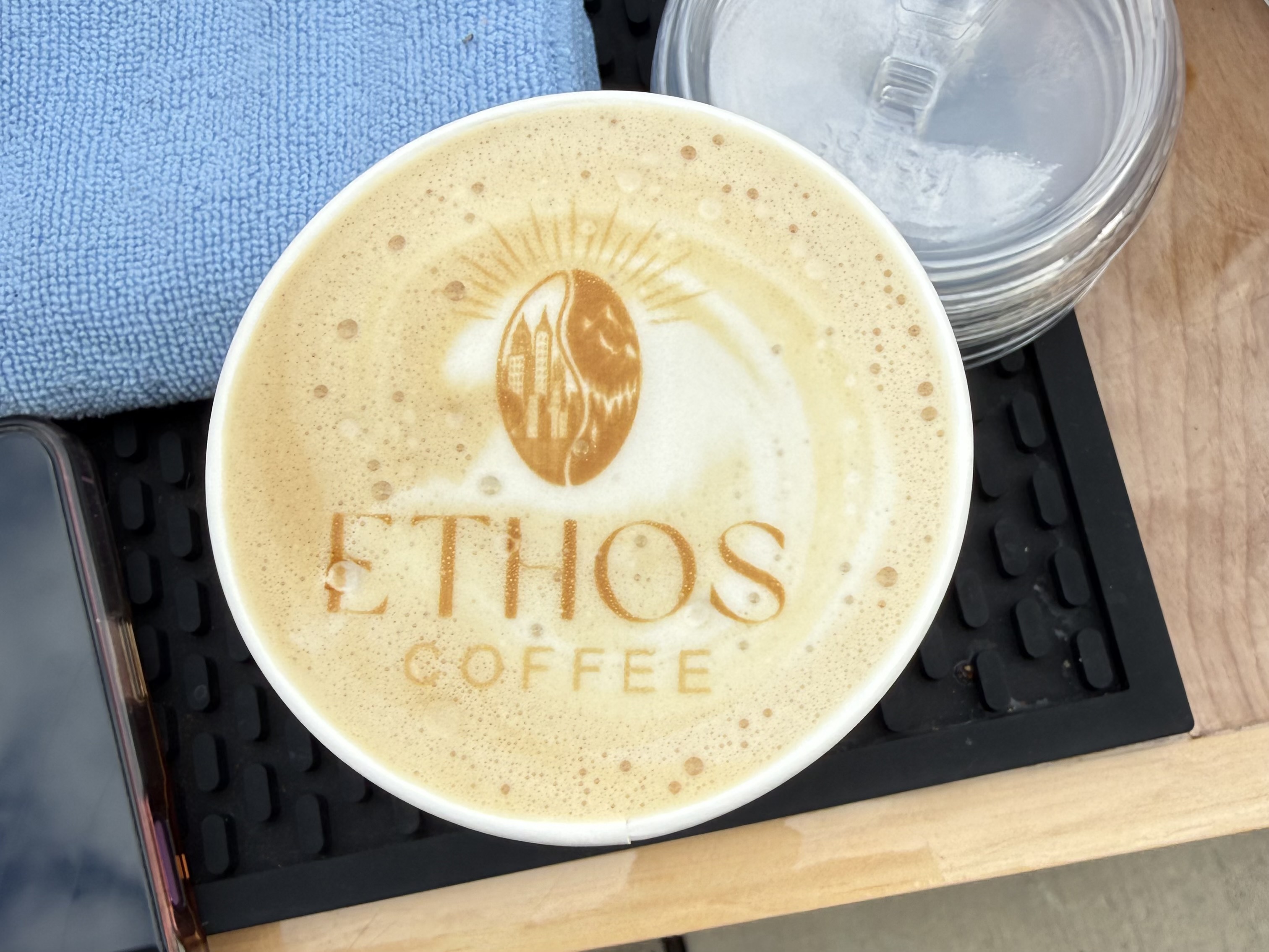 Ripple printed Ethos Coffee logo in the foam of a latte