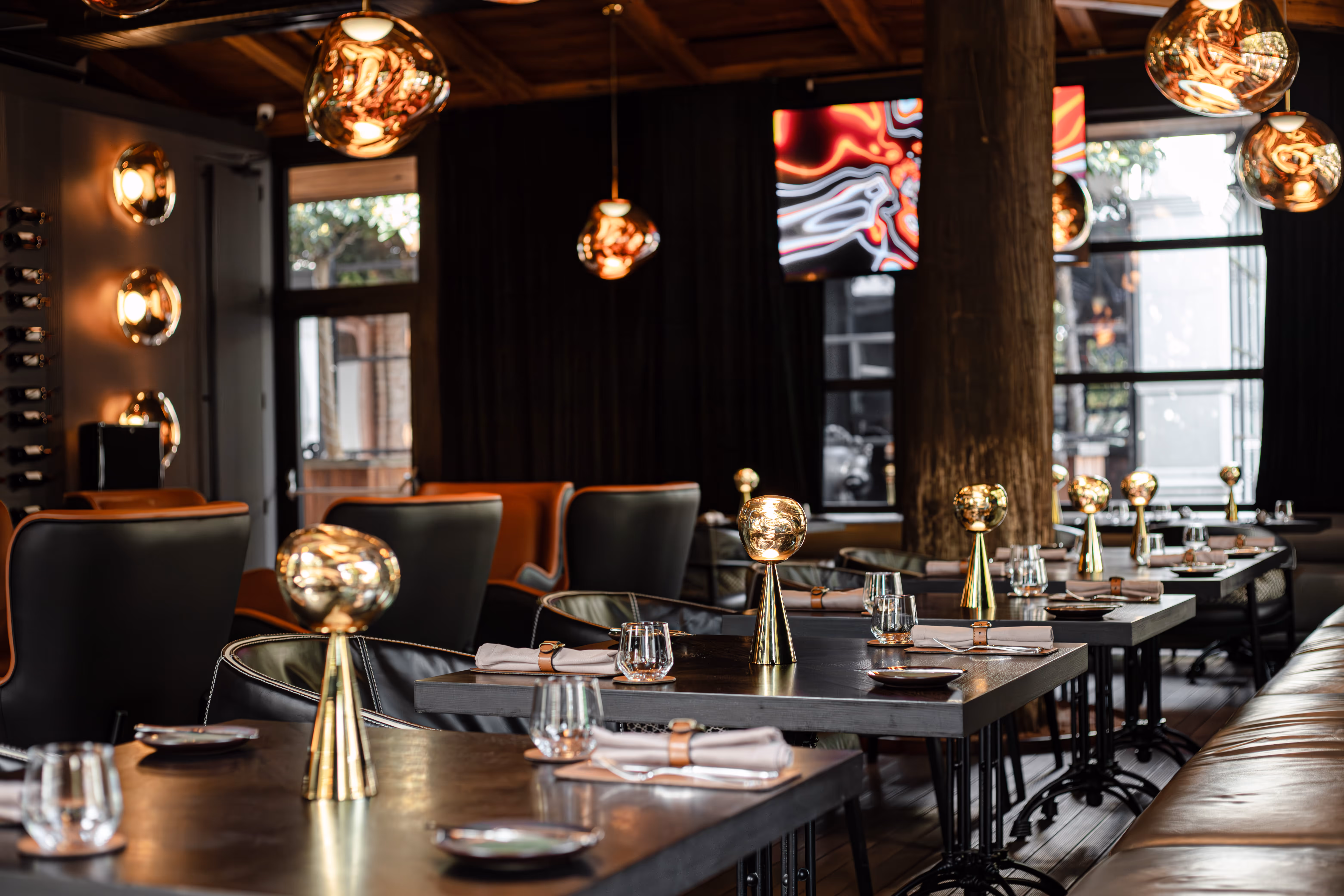 A restaurant located in Batumi, Goegria. Restaurant Secret of Mandarin, in the hotel Mandarin Club House. Dark themed lounge restaurant with Tom Dixon meltin bronze lamps.