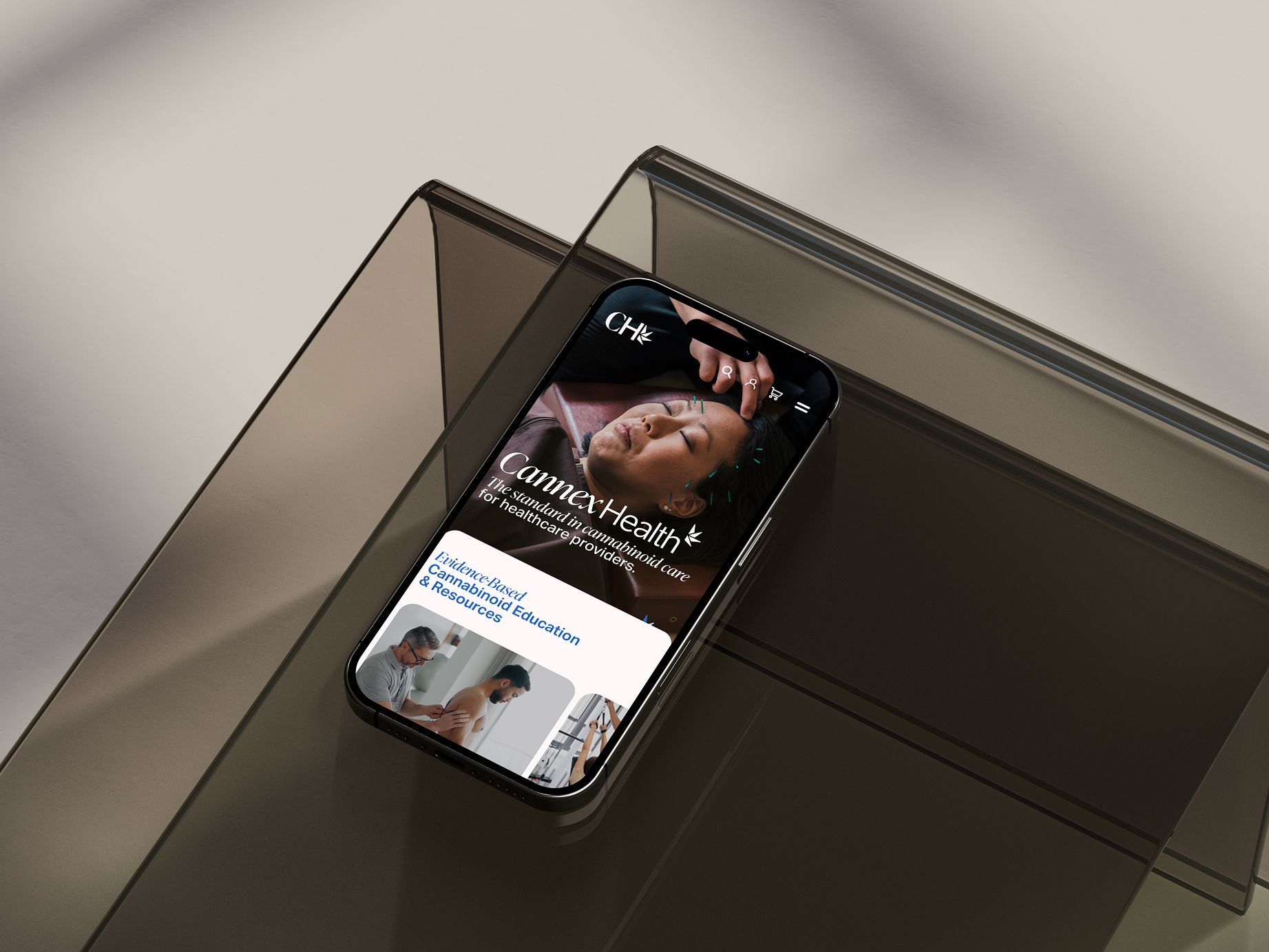 Smartphone showing CannexHealth site with acupuncture image and cannabinoid education resources.