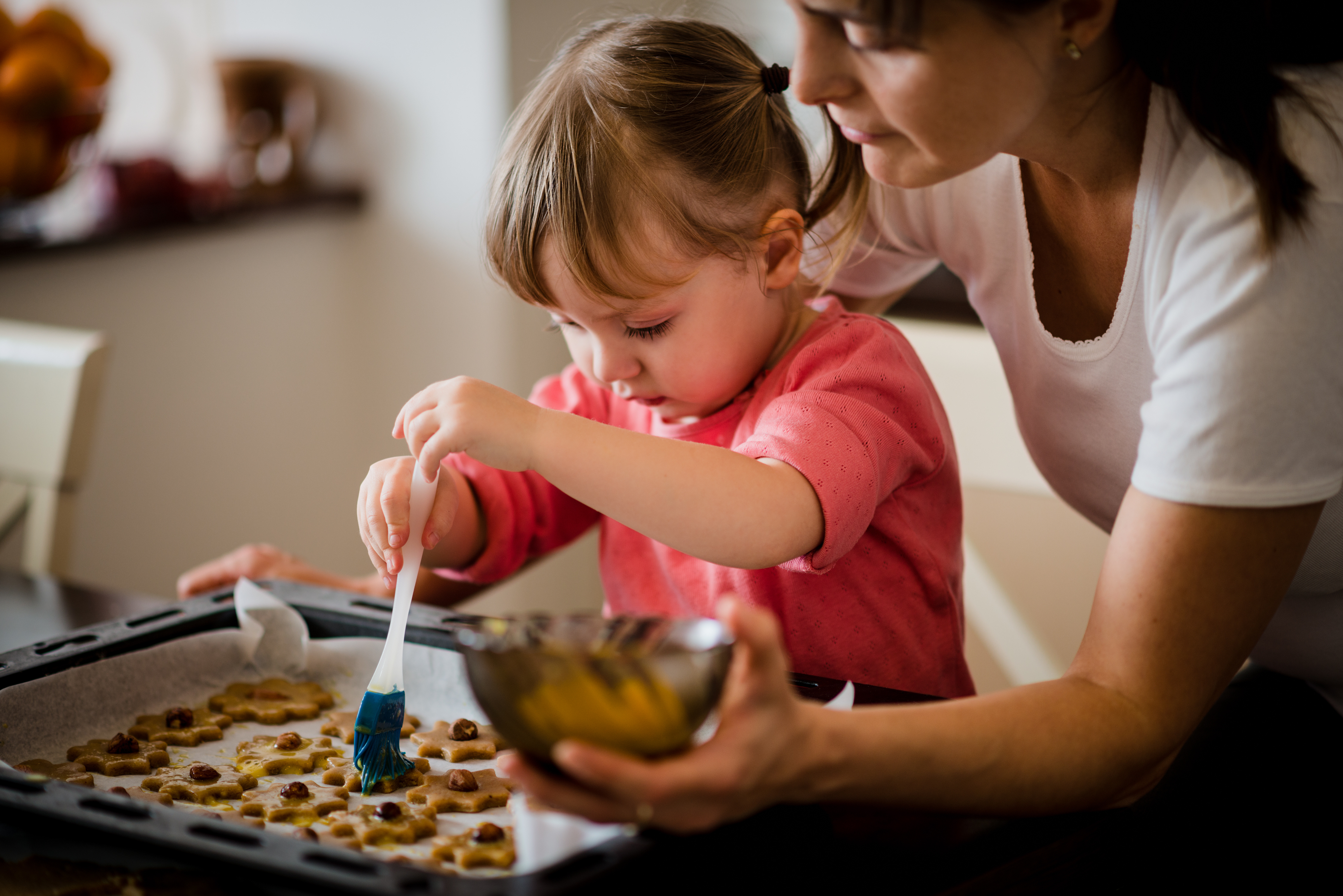 Mom and child making cookies stock image