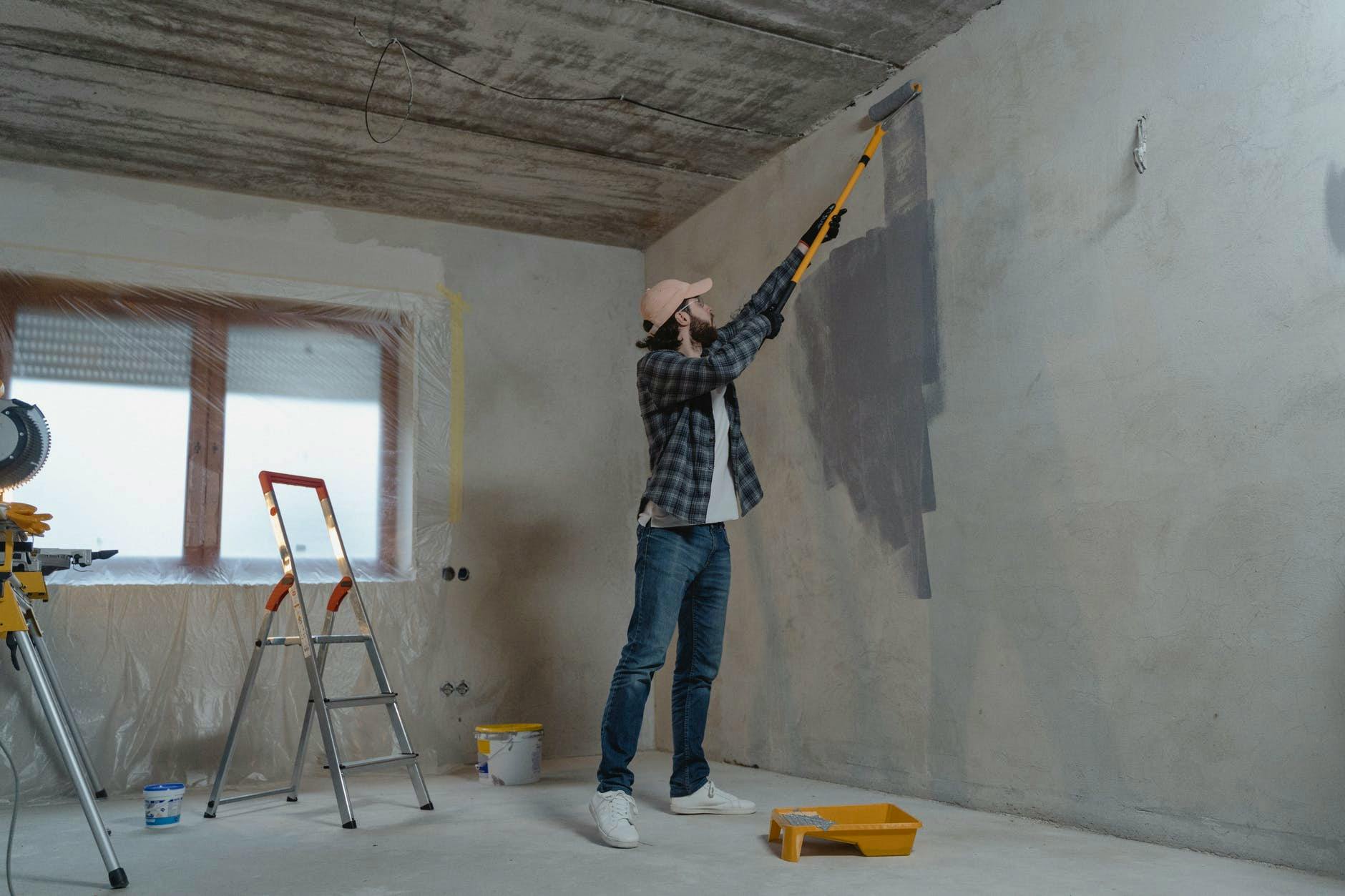 man painting the wall