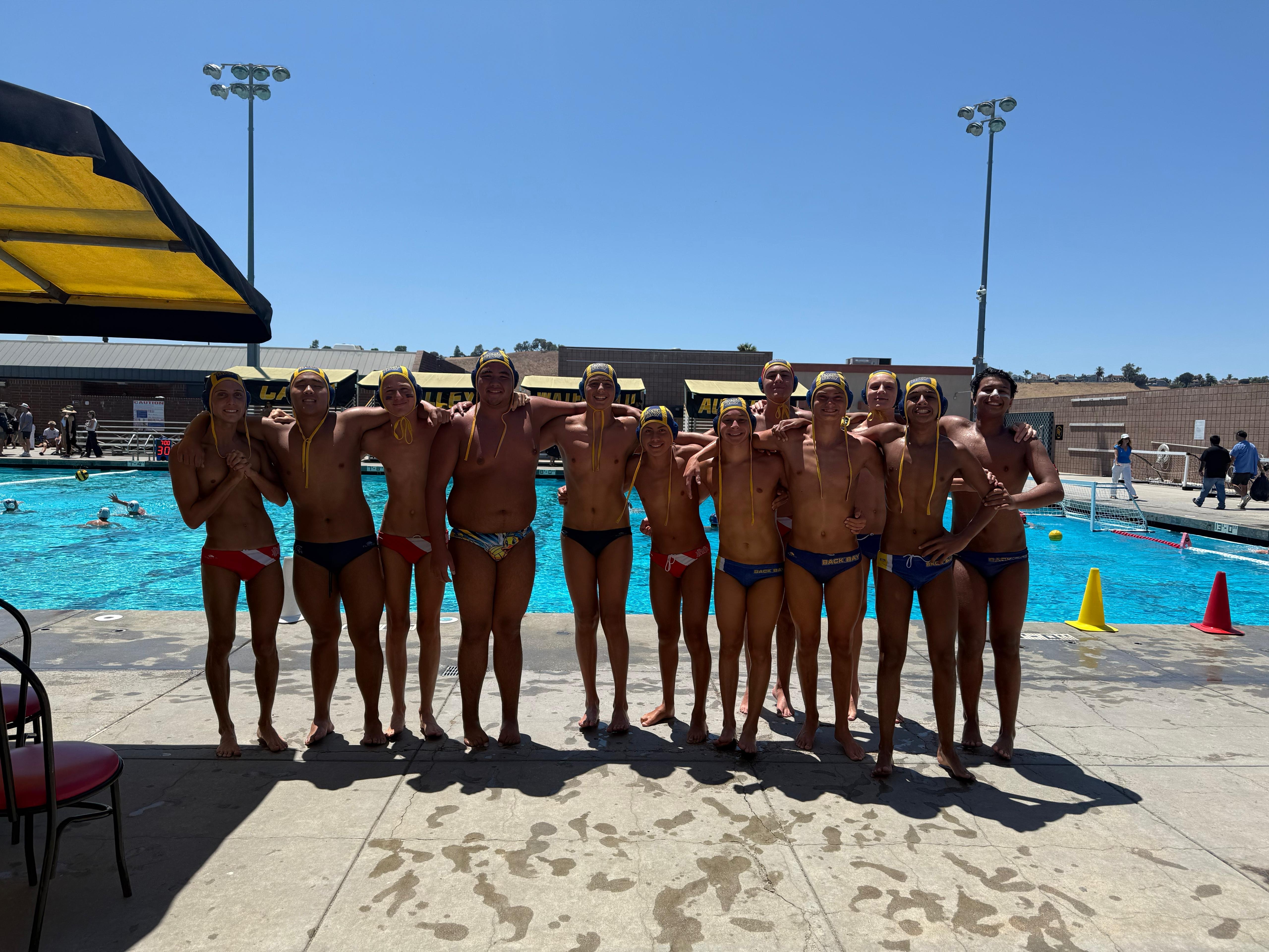 Back Bay swimmer racing freestyle with the SoCal hills behind