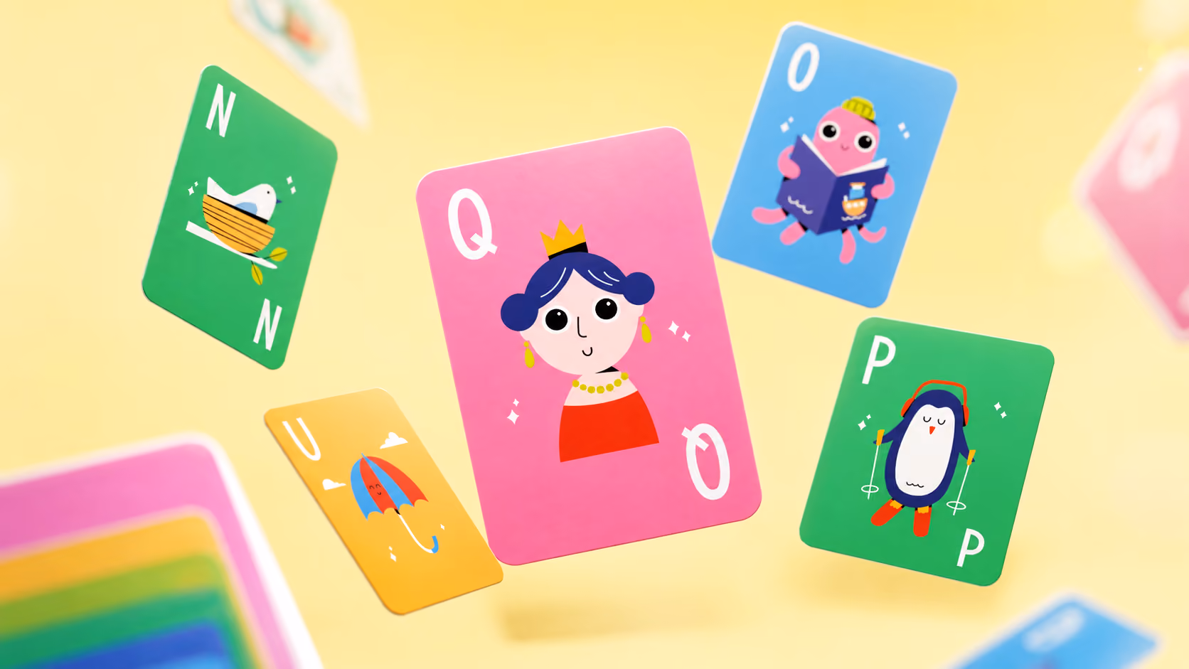 Colorful flashcards with cartoon images and letters floating against a yellow background.