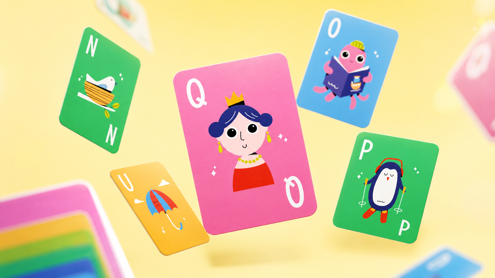 Colorful flashcards with cartoon images and letters floating against a yellow background.