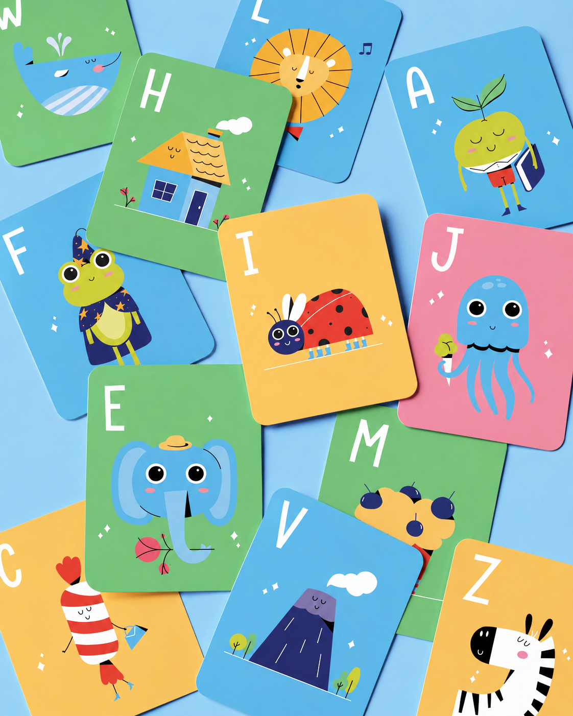 Colorful alphabet cards with cute animal and object illustrations scattered on a blue surface.