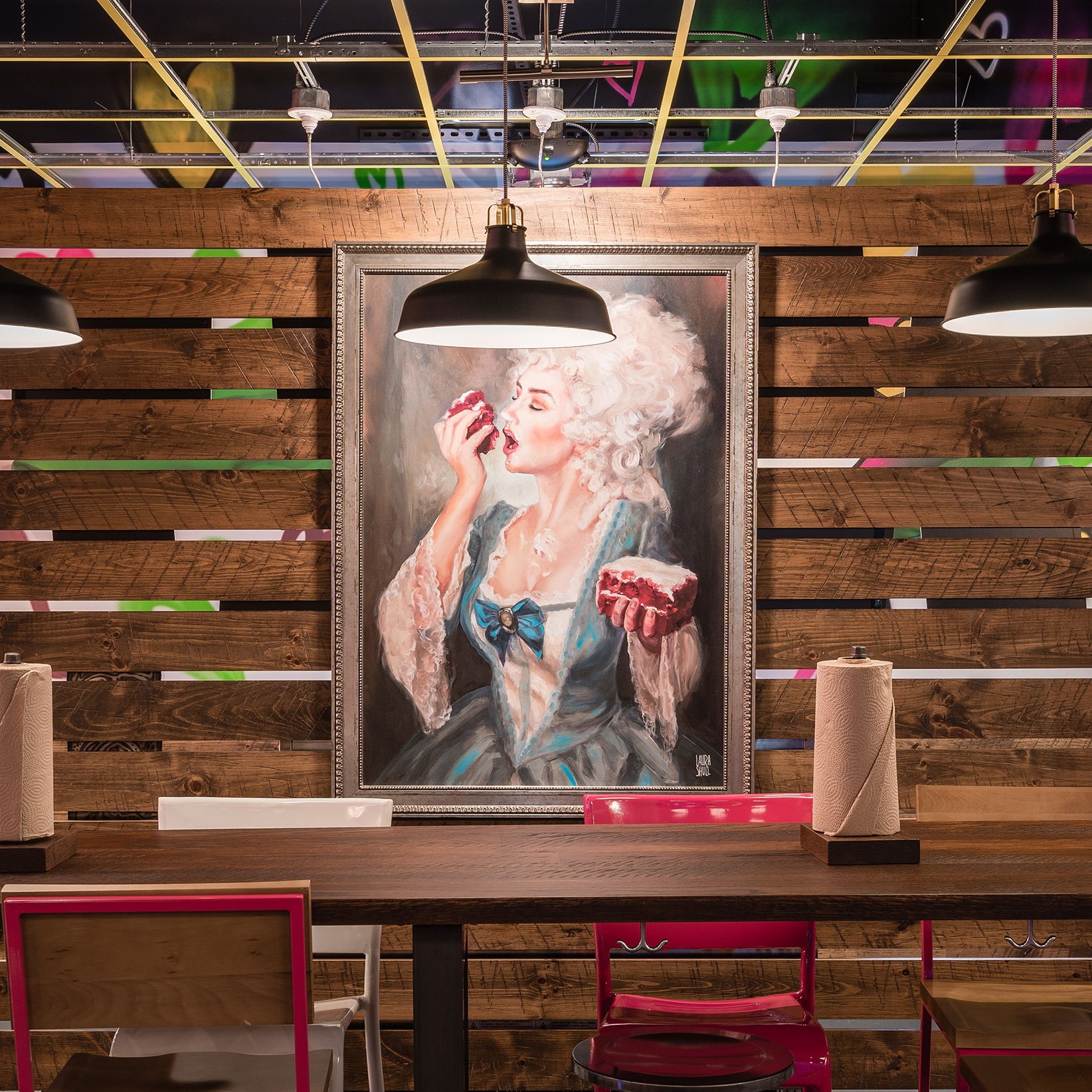 Framed painting of Marie Antoinette in a Velvet Taco restaurant.