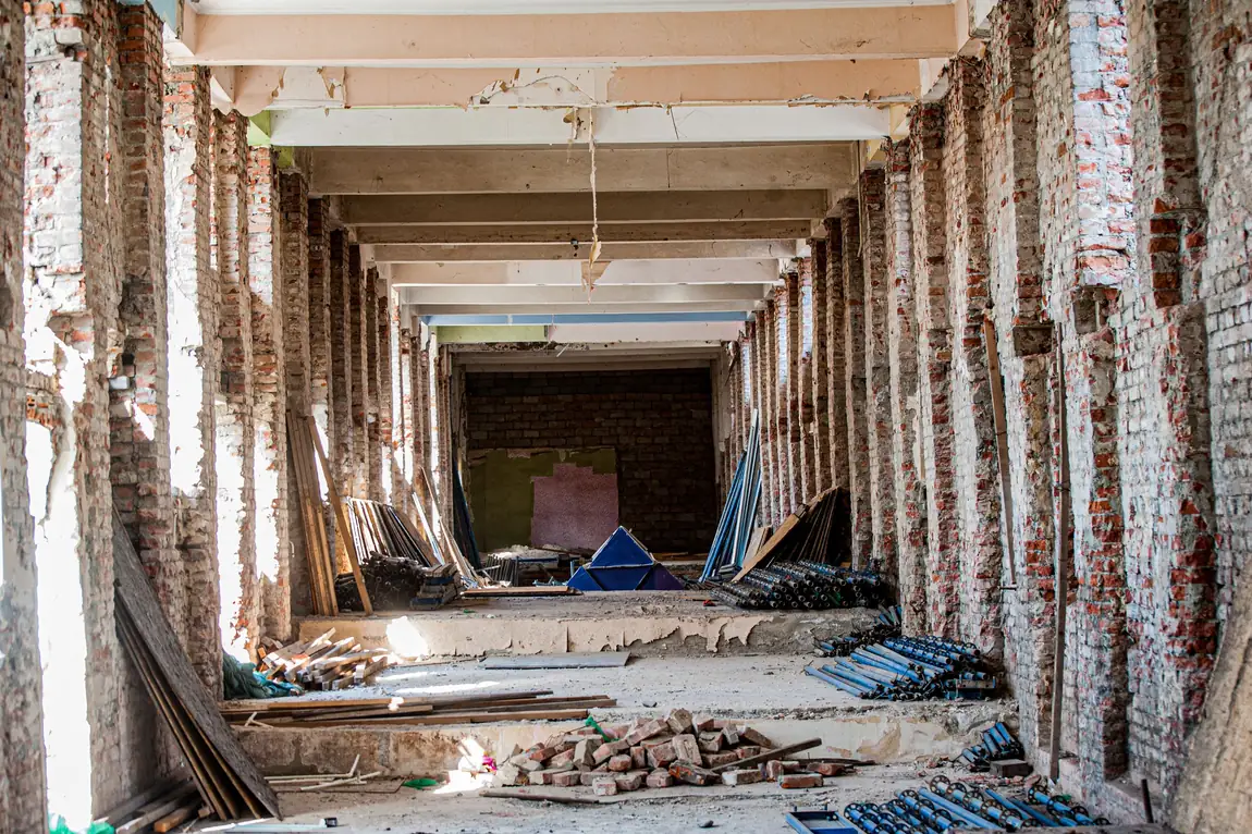Commercial interior stripped to brick columns and exposed beams during a retail space remodel