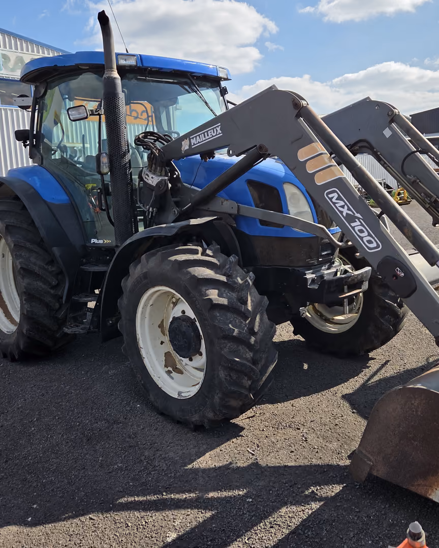 New Holland tractor with front loader and bucket