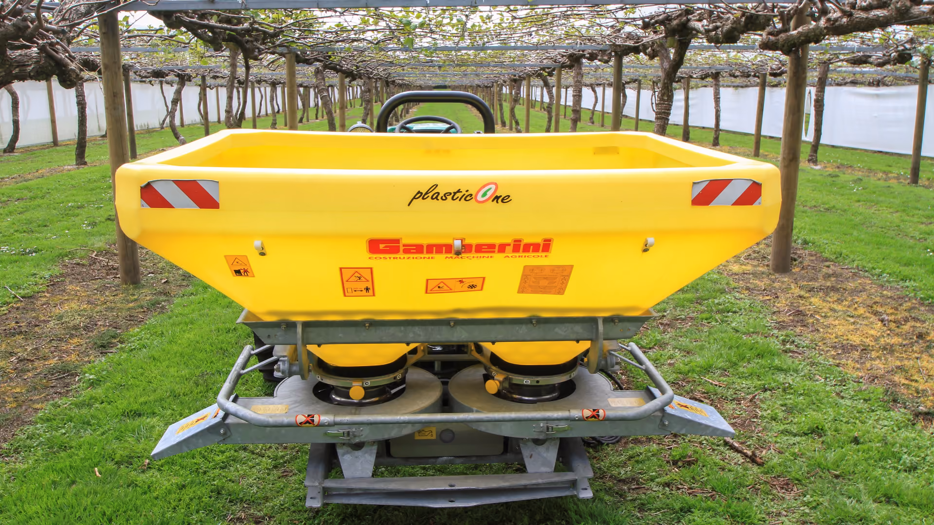 Gamberini fertiliser spreader under a kiwifruit pergola