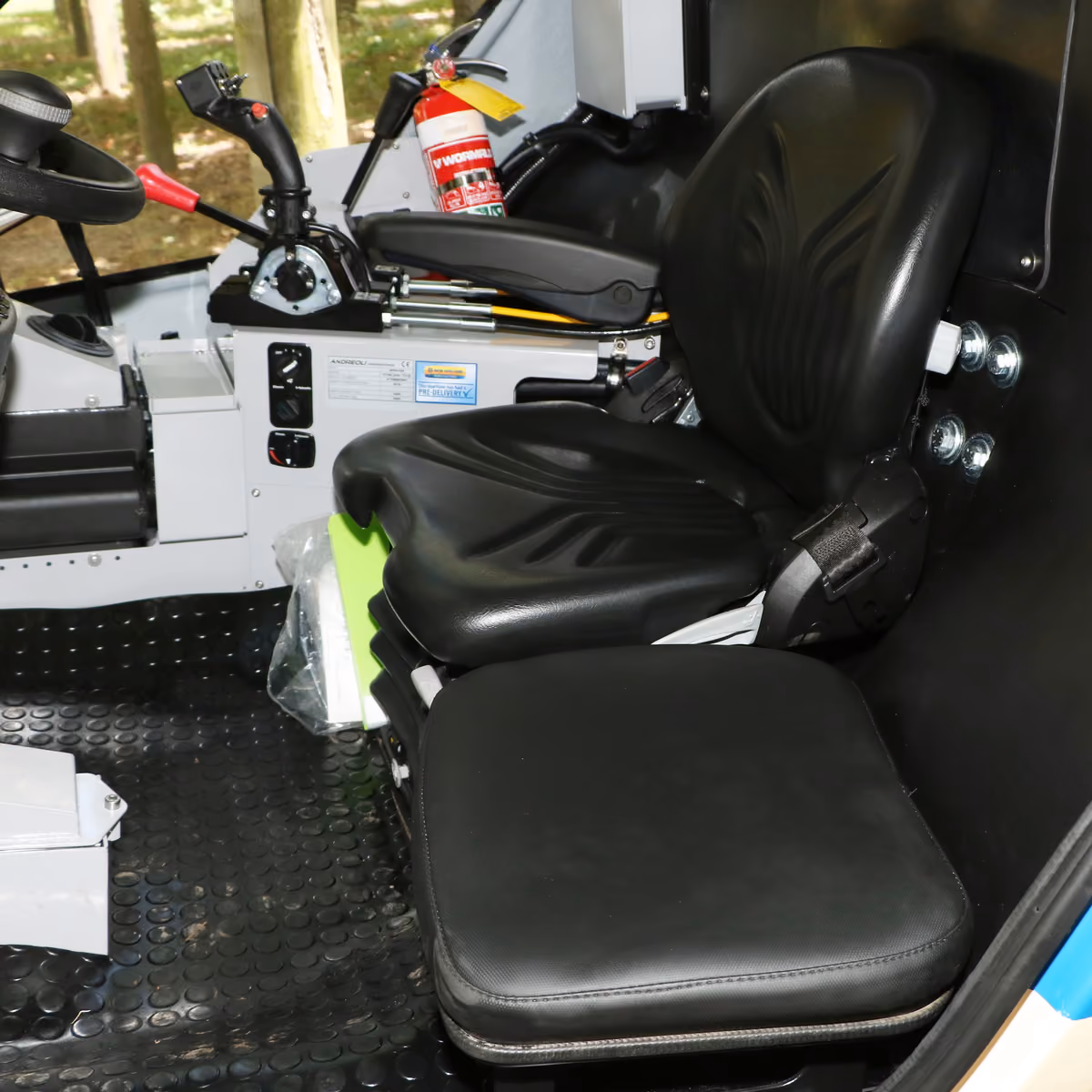 Operator seat and controls inside the Atom 2000's sealed cab