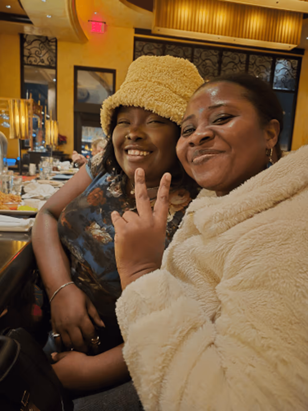 Five women posing and smiling together inside a seafood restaurant named Salt and Sea.